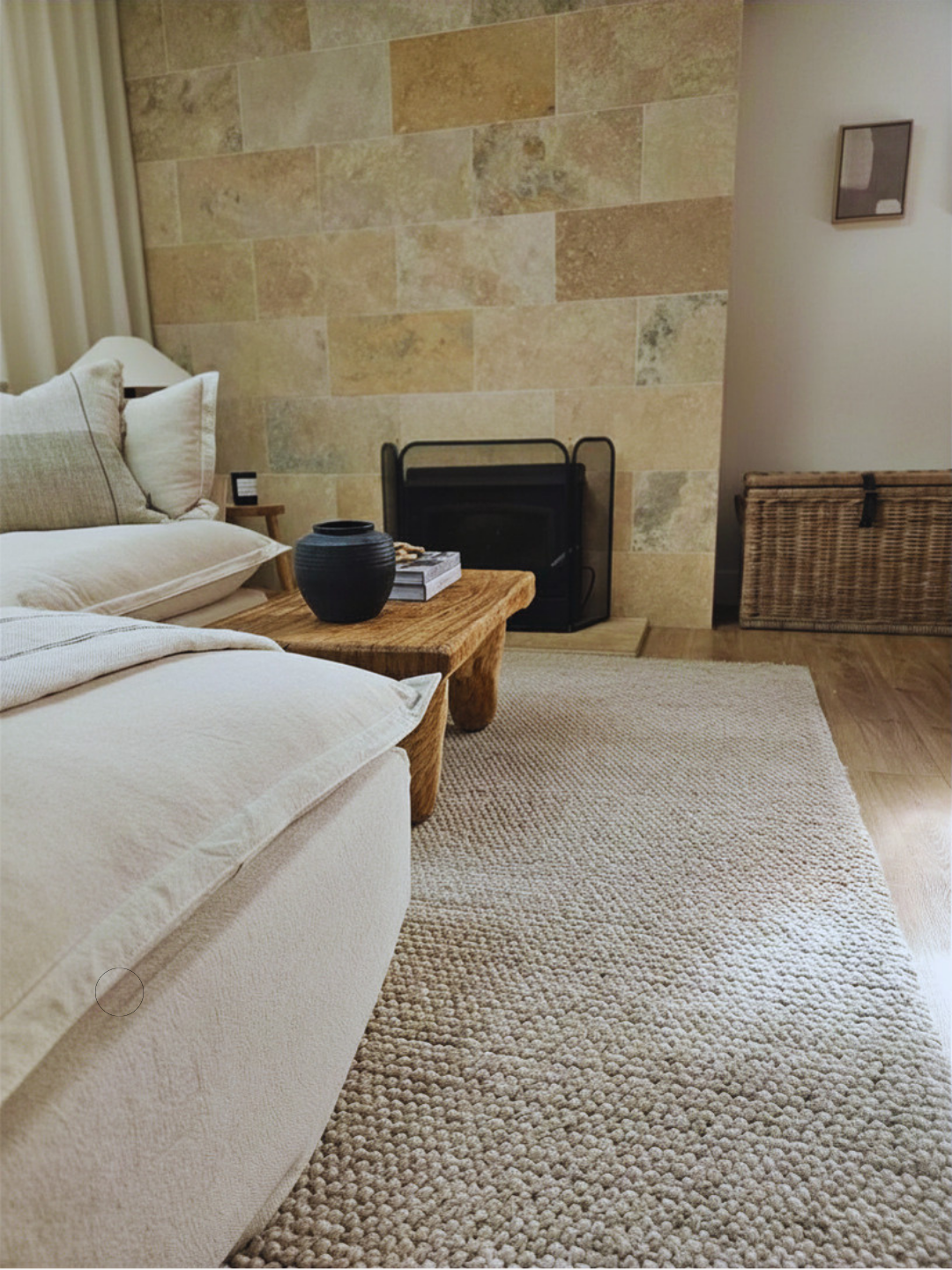 Living room styling with timber coffee table, stone fireplace and woven storage trunk, Glenelg Retreat renovation by Young & Co Interiors