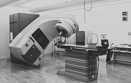 Specialized medical equipment in a sterile room, monochrome.