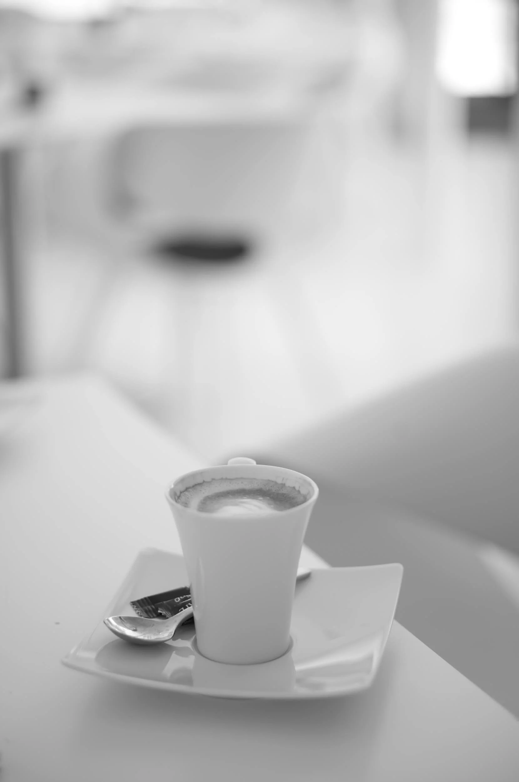 Cup of coffee photographed at the Leitz Café with the original ELCAN 66mm f/2 on the Leica M11 Monochrom.