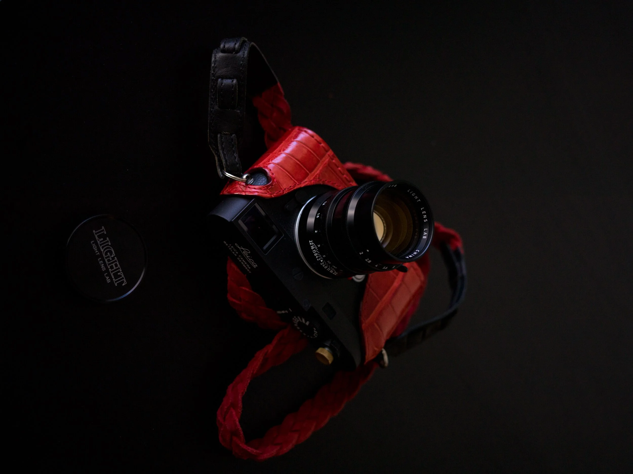 Light Lens Lab 75mm f/2 SPII mounted on Leica M11-D wtih Angelo Pelle red case
