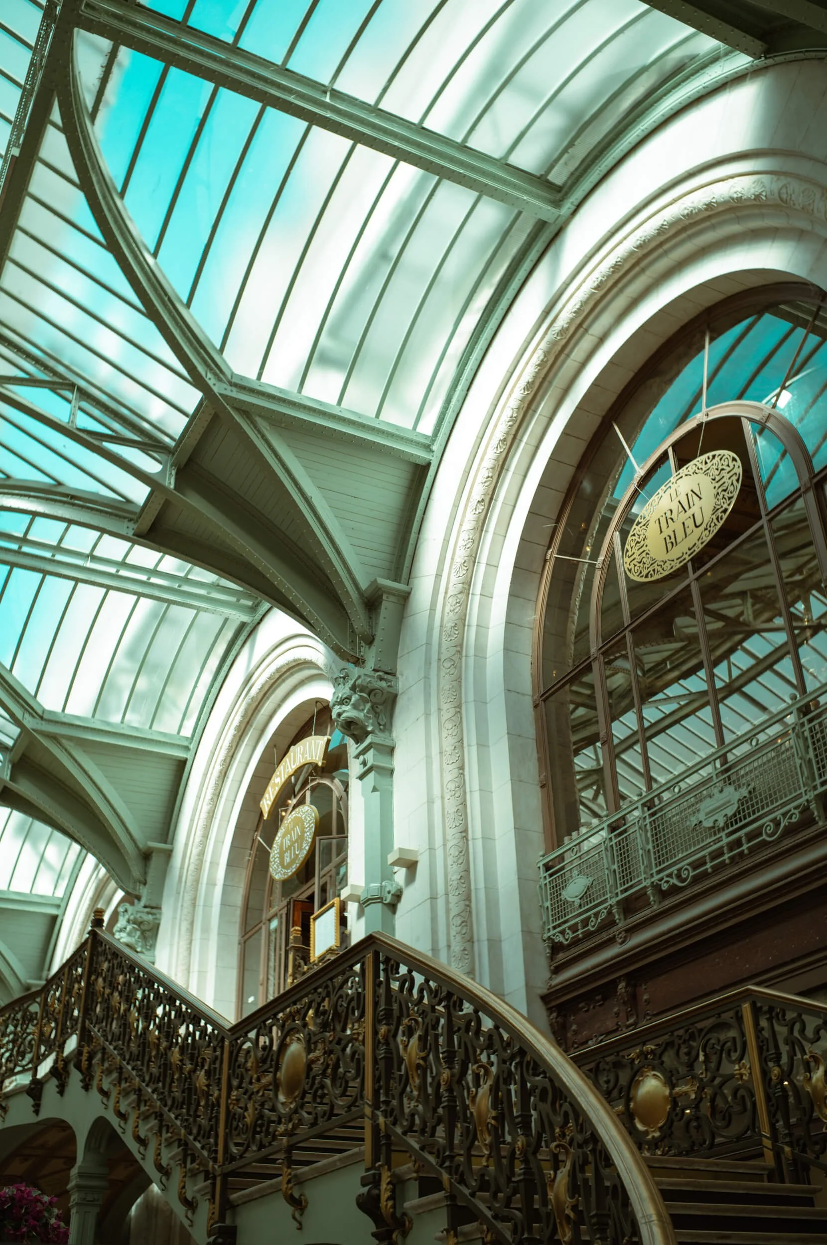 The ornate entrance and staircase of Le Train Bleu inside Gare de Lyon in Paris, photographed with the Mandler 35mm f/2 and Leica M11-D.