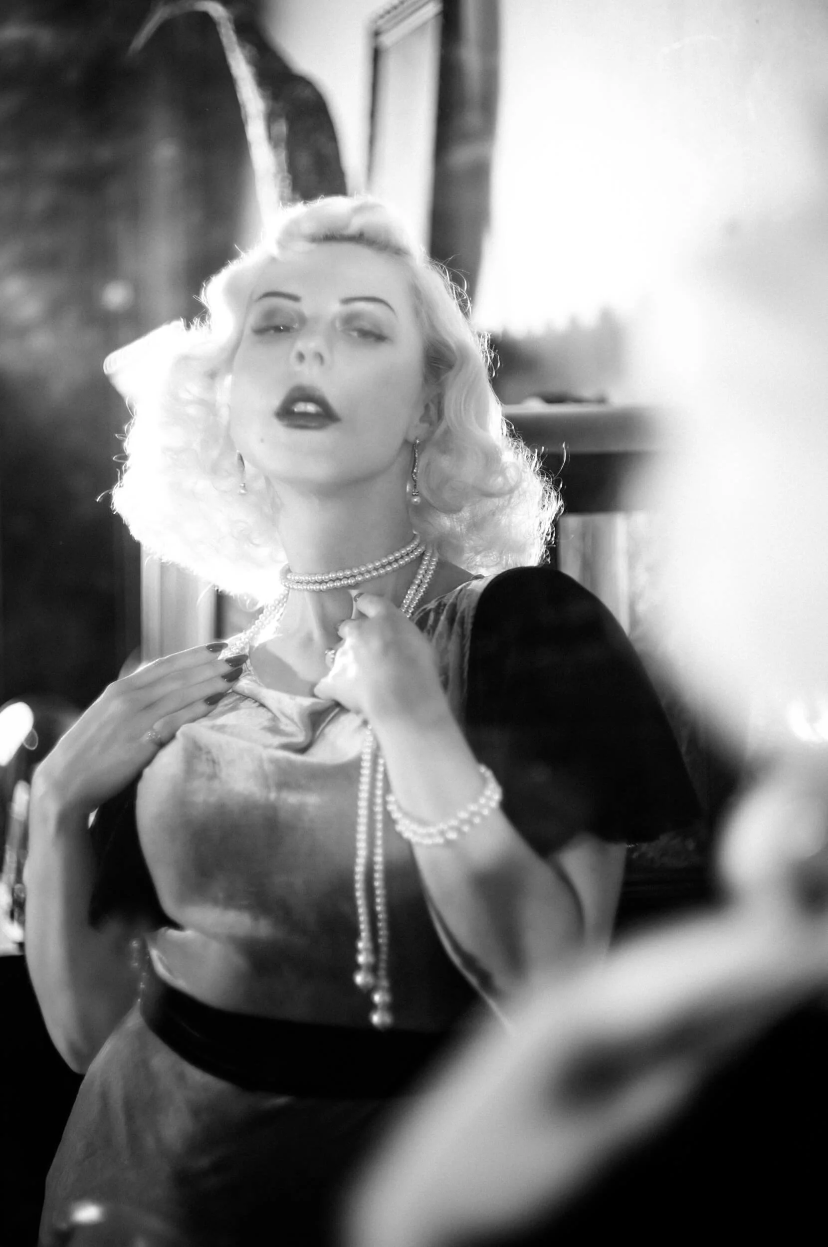 Yulia wearing pearls photographed with the Light Lens Lab 75mm f/1.5 Z21 on Leica M11 Monochrom