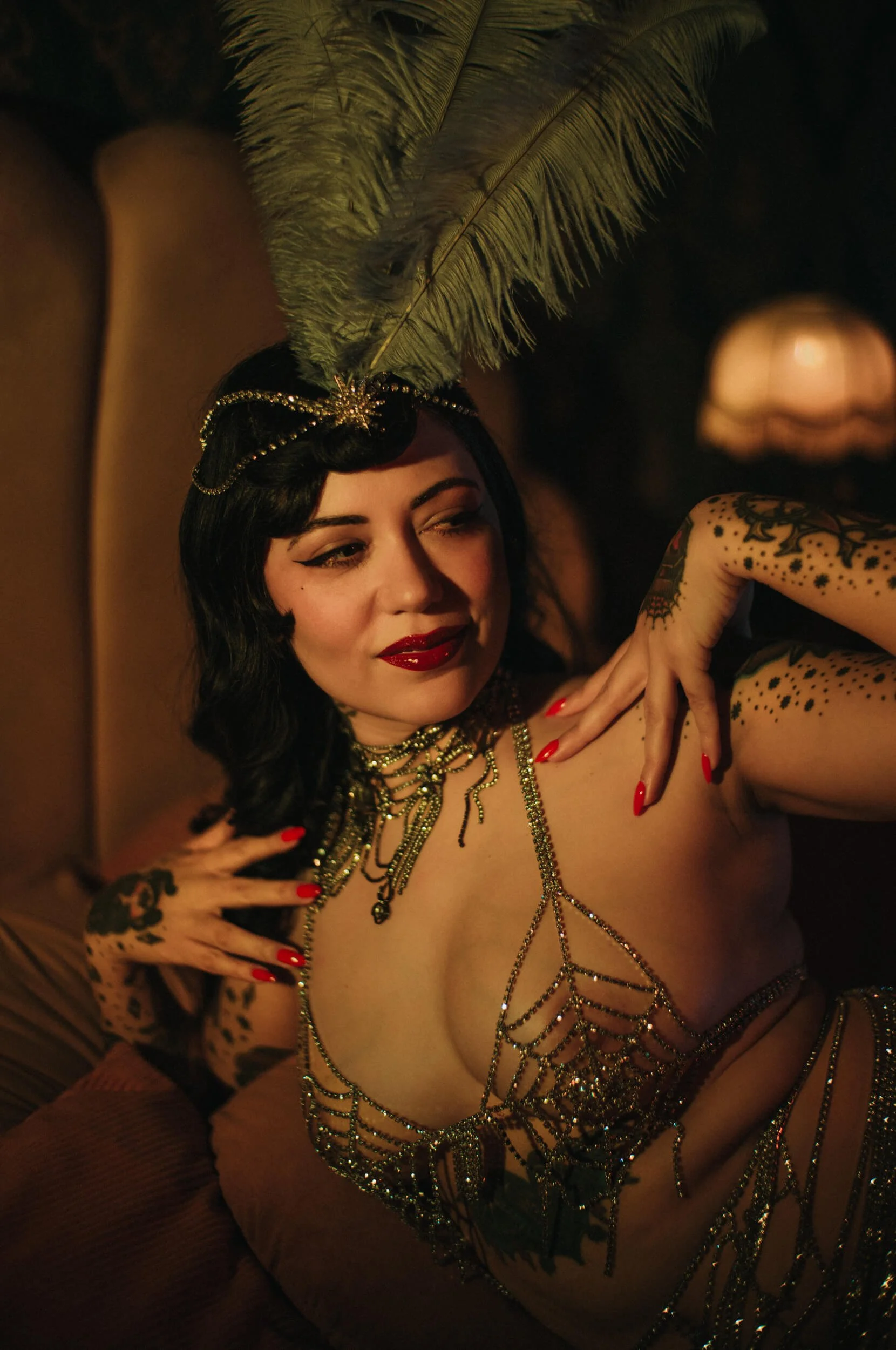 Cinematic portrait of Bettie from Hell photographed with the Mandler 50mm f/1.4 E46 Pre-A, using warm light and shallow depth of field.