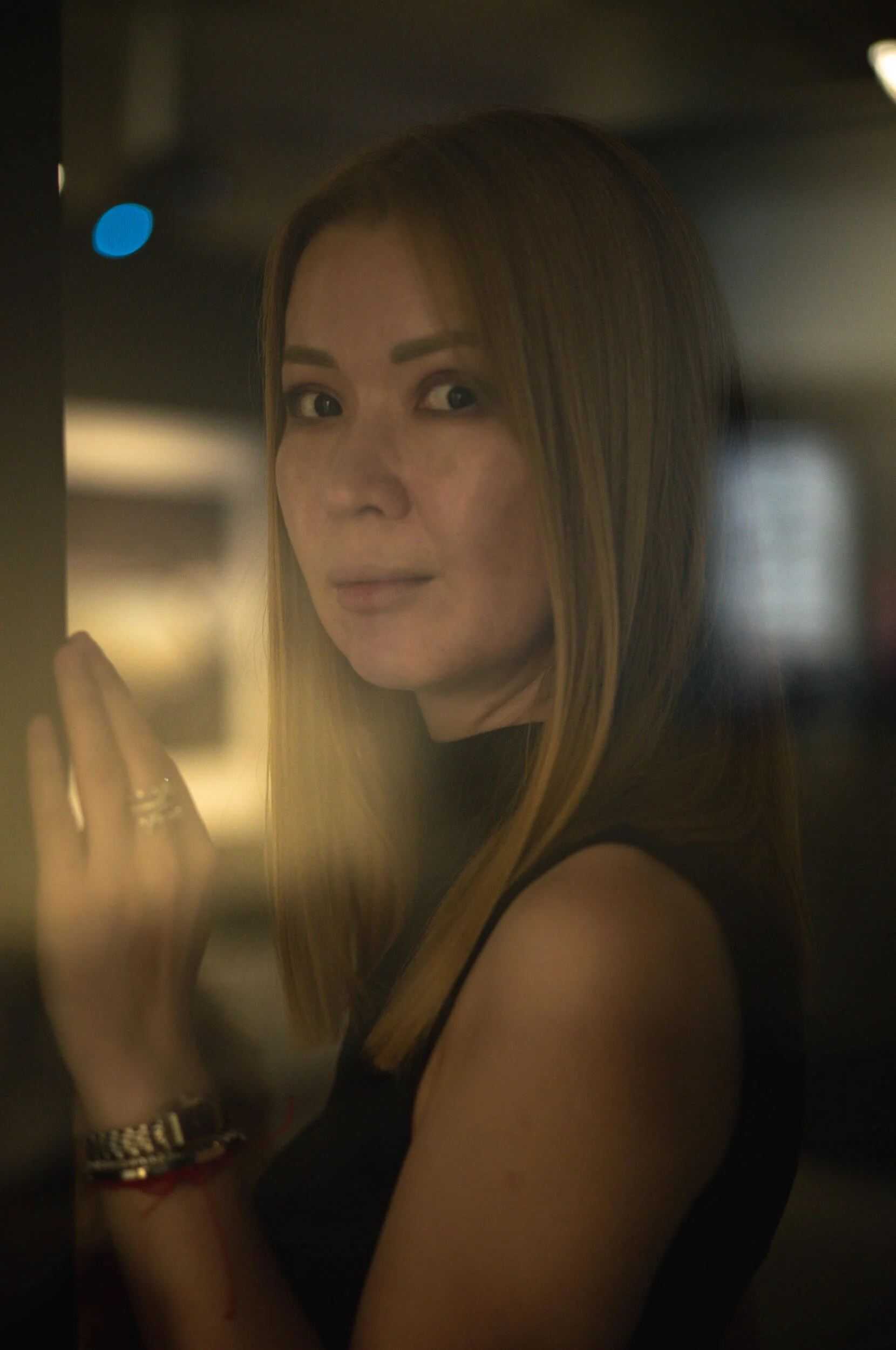 Portrait of Aliya photographed with the original ELCAN 66mm f/2 at the Ernst Leitz Museum using reflected light from a glass door.