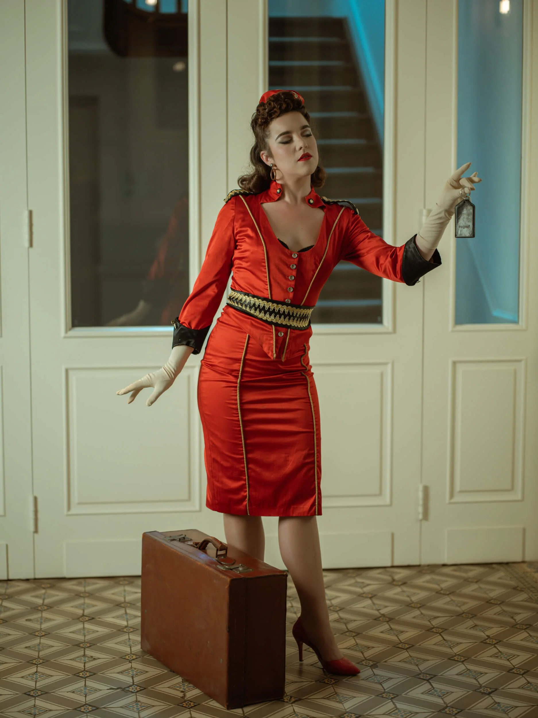 Jennifer walking through Hotel August carrying luggage