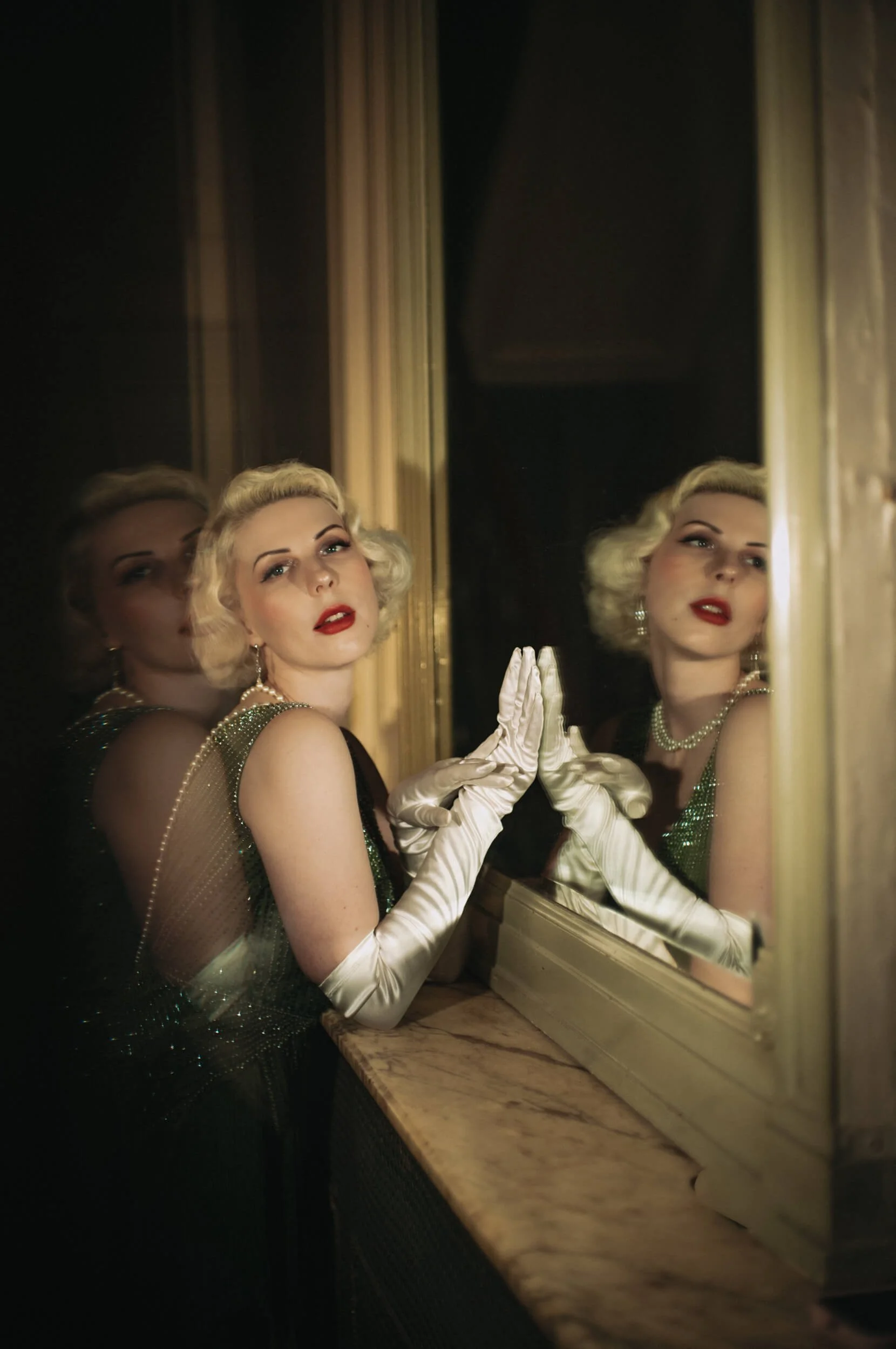 Multiple reflections of Yulia photographed with the Light Lens Lab 50mm f/1.9 Rigid-ZS6 in an Art Deco interior.