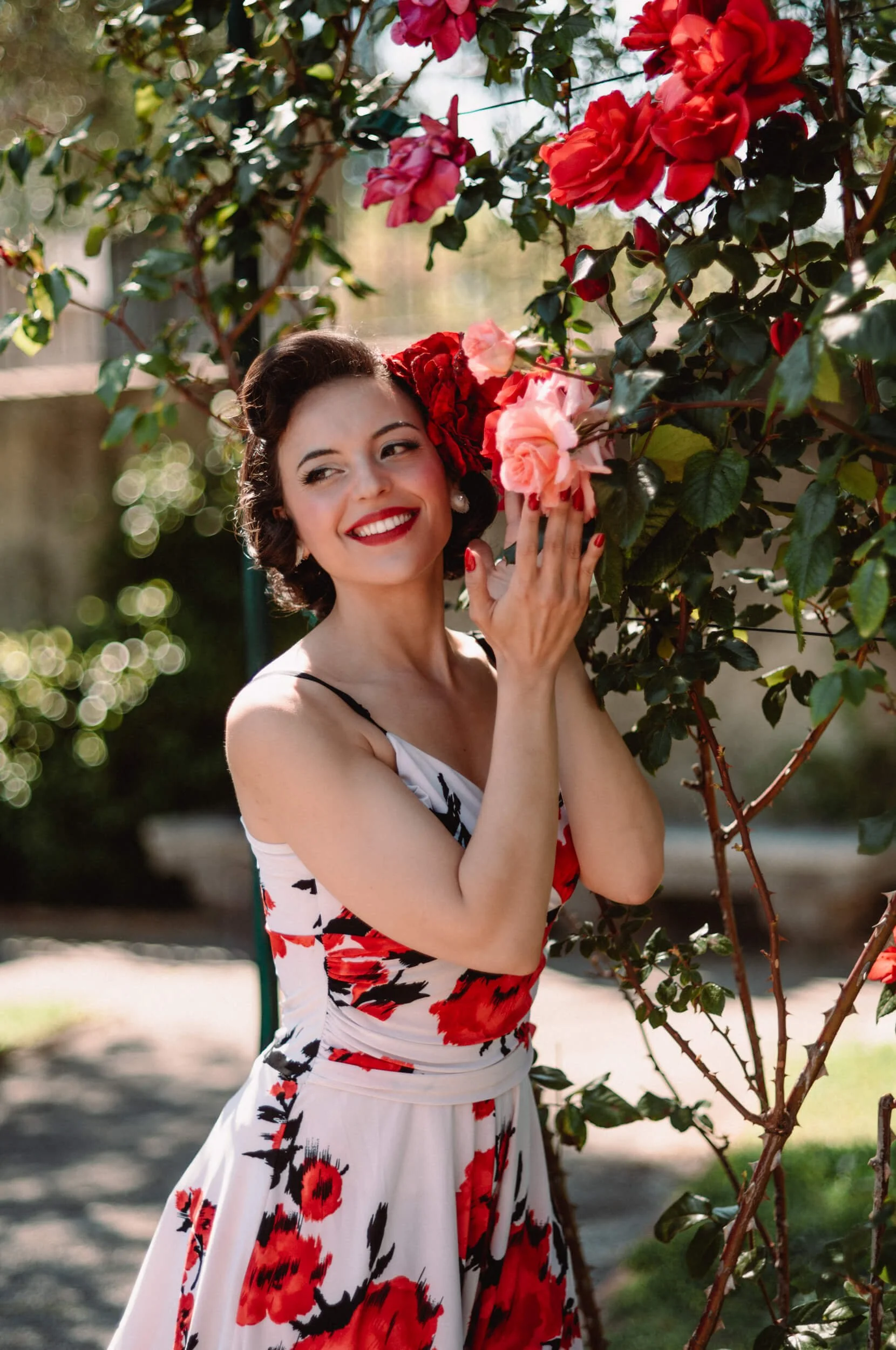 Smiling portrait in rose garden photographed with the Light Lens Lab 75mm f/2 SPII on Leica M11-D