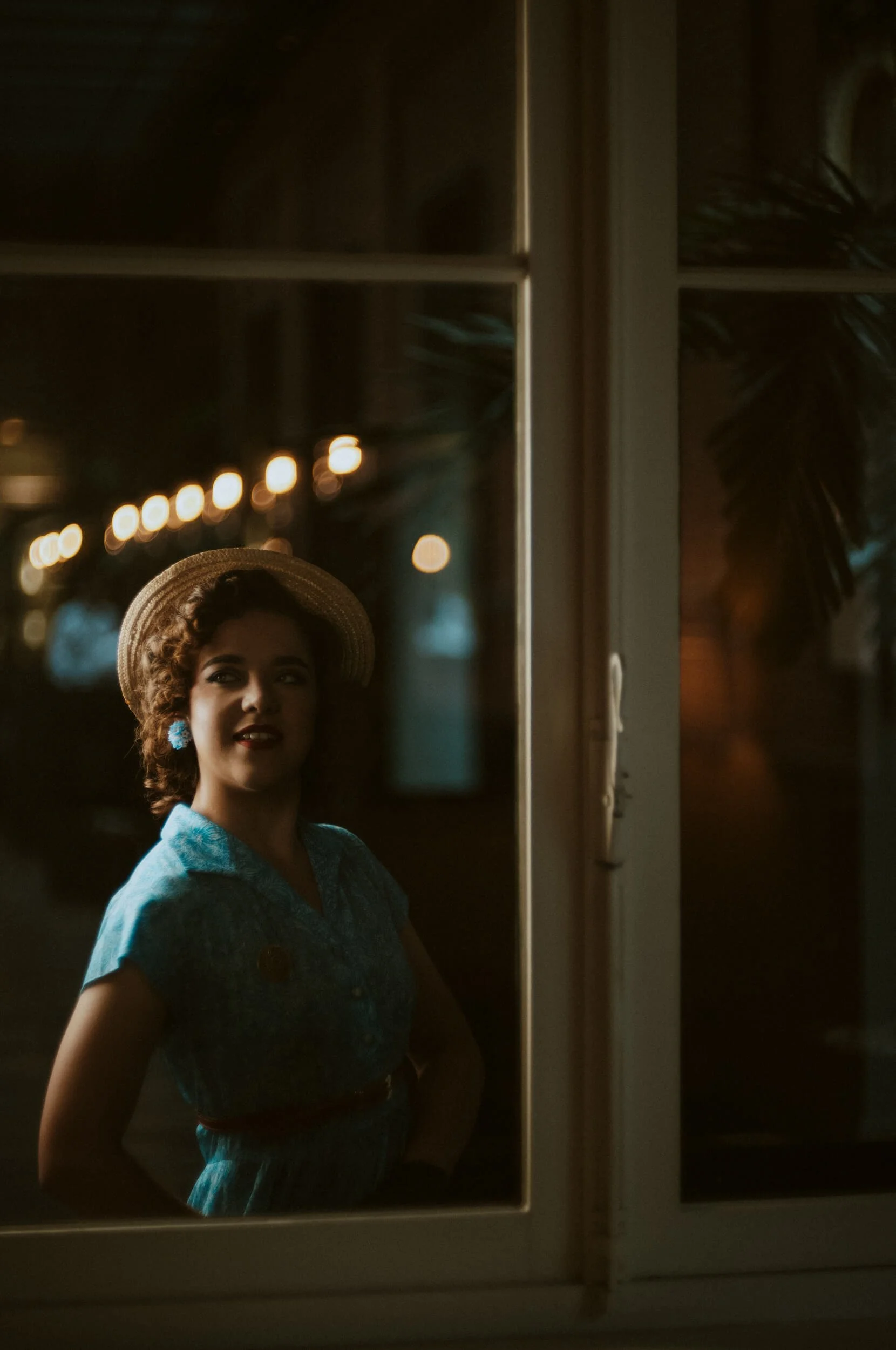 Jennifer photographed through a window with the Light Lens Lab 75mm f/1.5 Z21