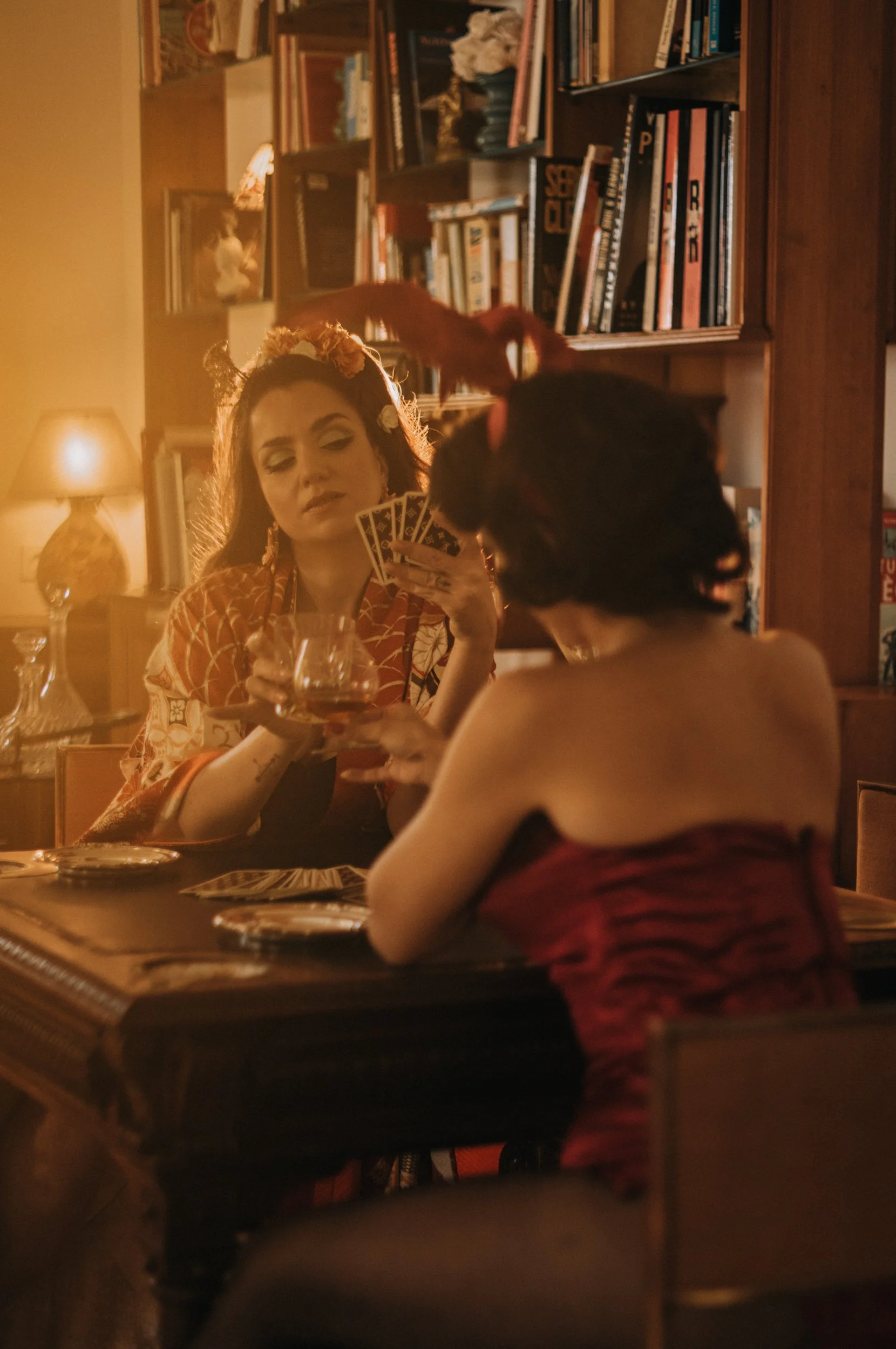 Cinematic card game scene photographed with the Light Lens Lab 75mm f/2 SPII on the Leica M11-D