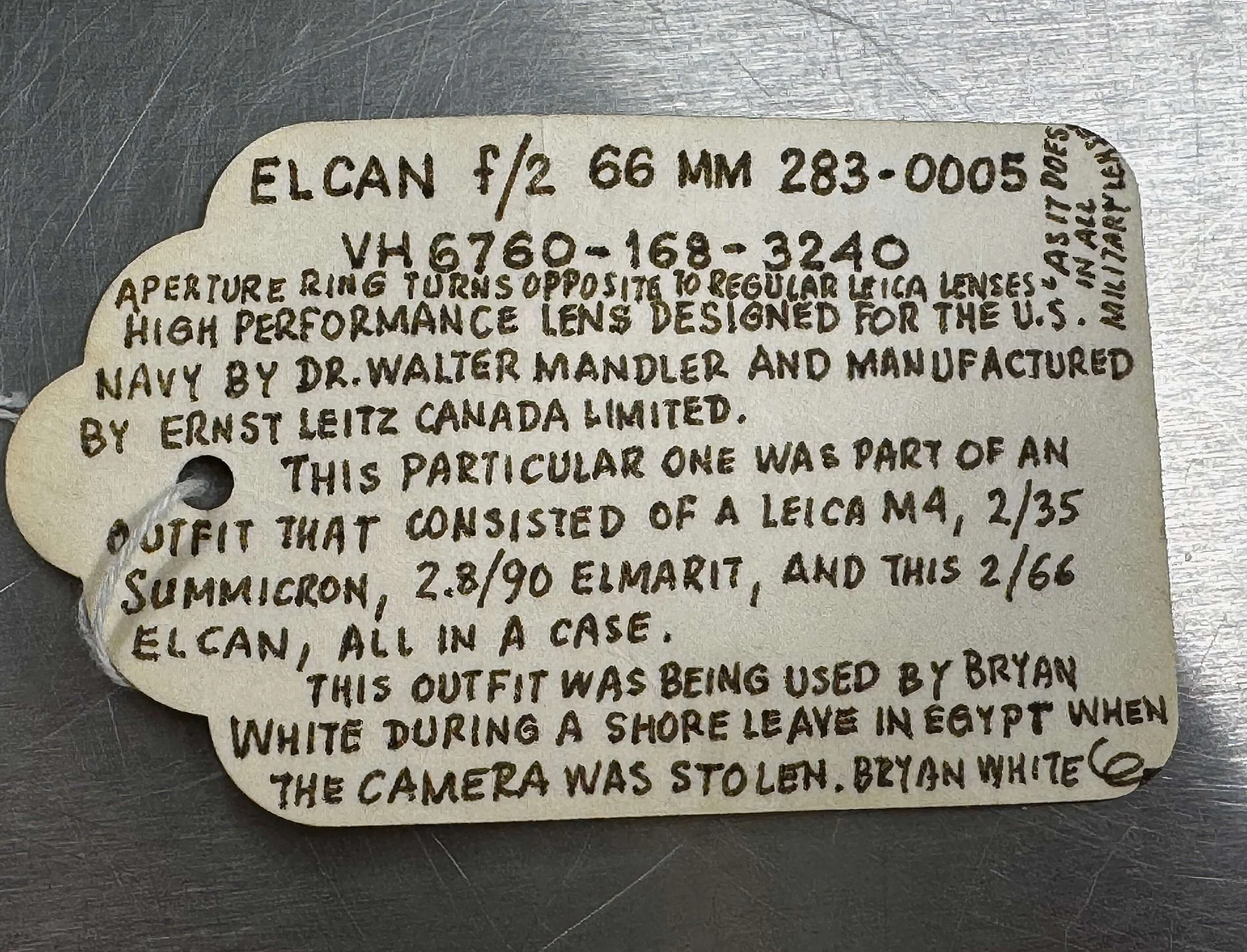 Front of Rolf Fricke's handwritten provenance tag documenting the history of the original ELCAN 66mm f/2 in the Leica Archives.