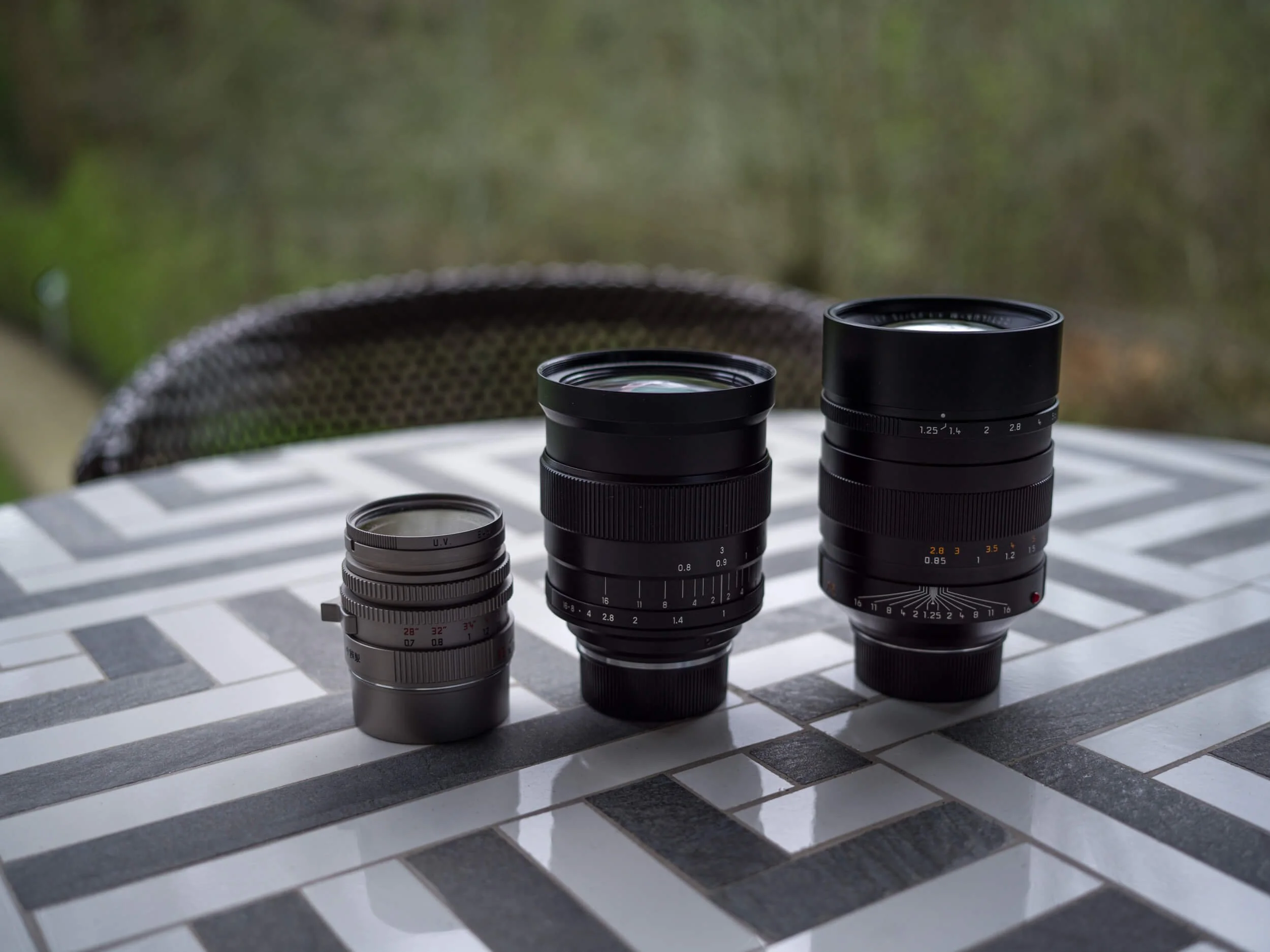 Size comparison from left to right: Light Lens Lab 35mm f/1.4 AA Titanium, Zenit Zenitar 35mm f/1, Leica Noctilux-M 75mm f/1.25 ASPH.
