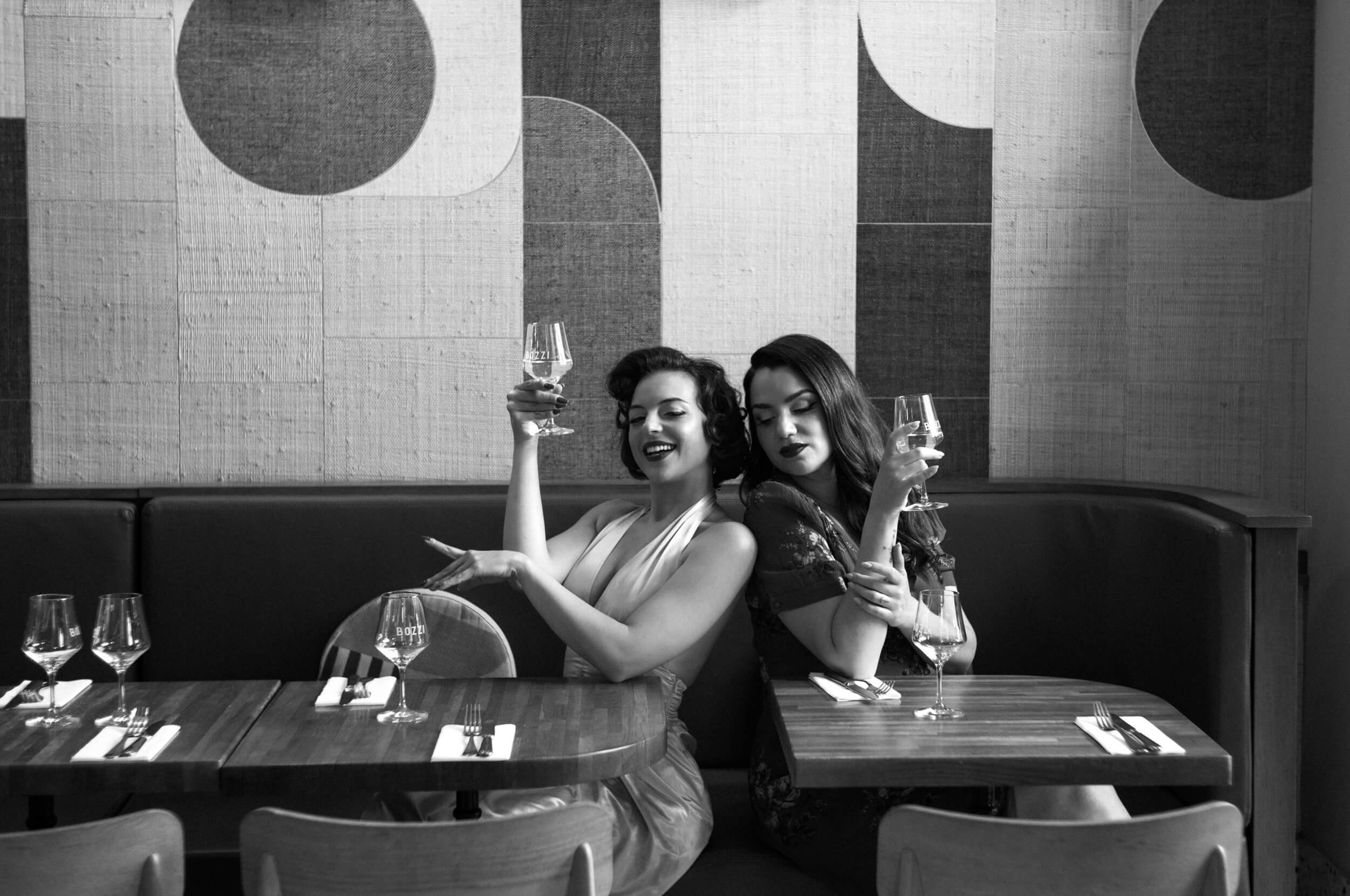 Black and white café portrait photographed with the Omnar Bertele 50mm f/2 showing classic Sonnar separation and tonal rendering