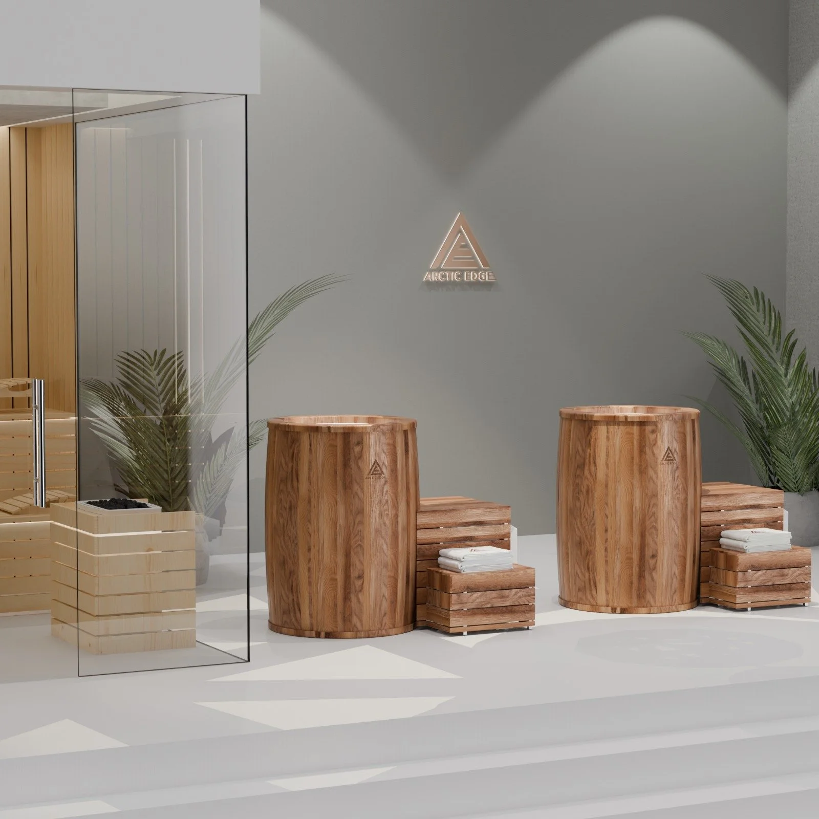 Spa reception area with wooden stools, folded towels, and plants, featuring the Arctic Edge logo on the wall.