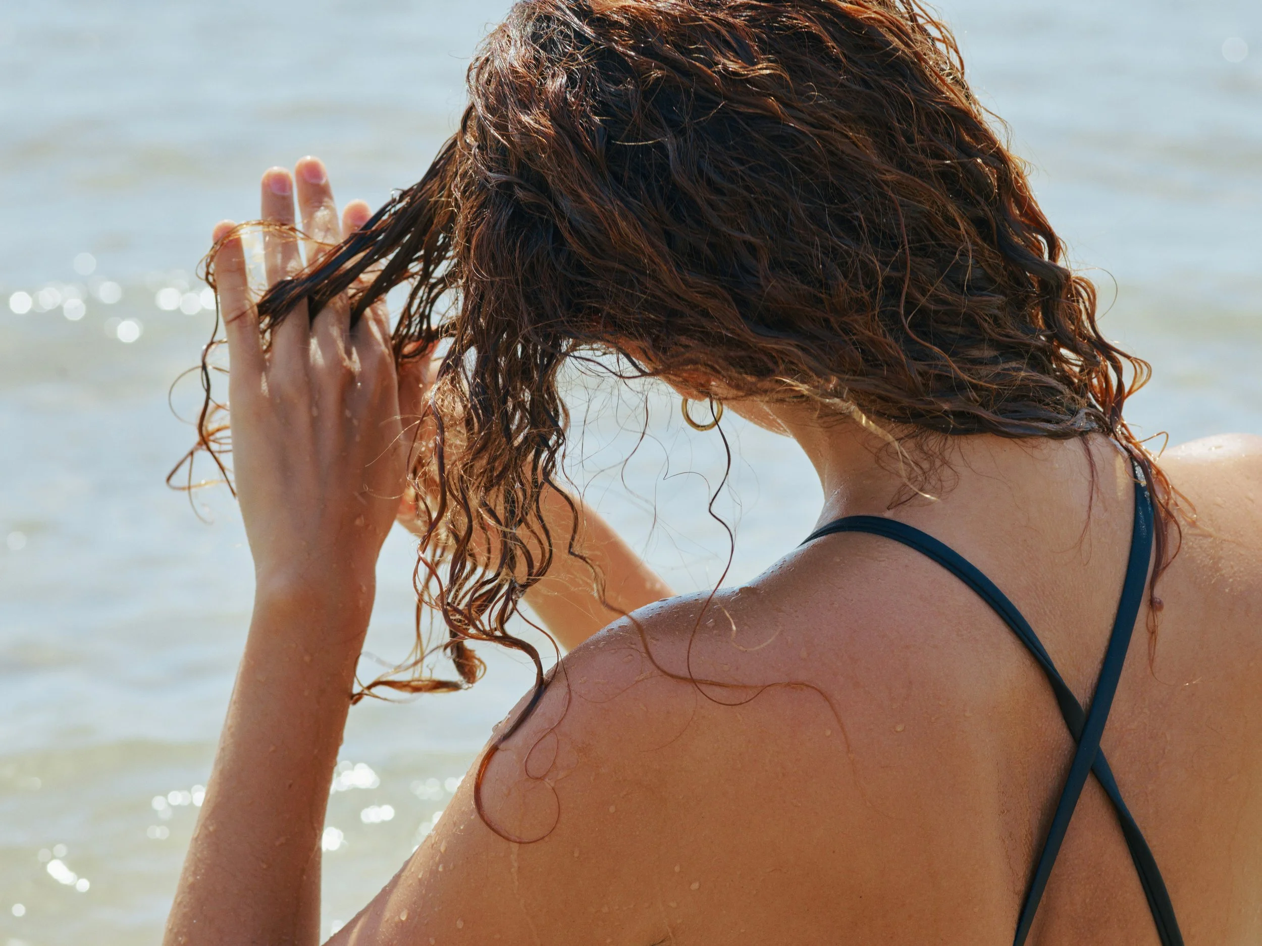 Sun, Salt, and Chlorine: How Summer Affects Your Scalp