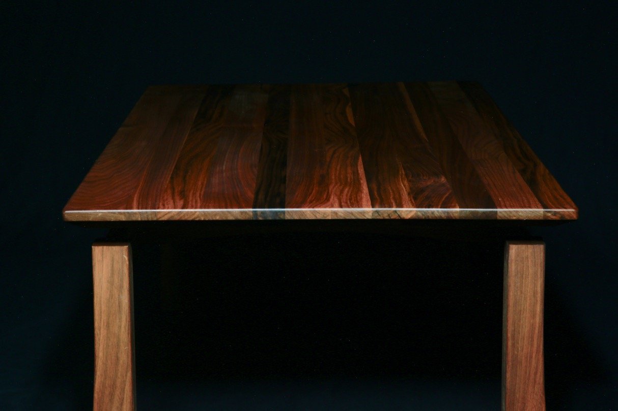 Walnut wooden coffee table with a dark, polished top surface in a traditional Japanese style
