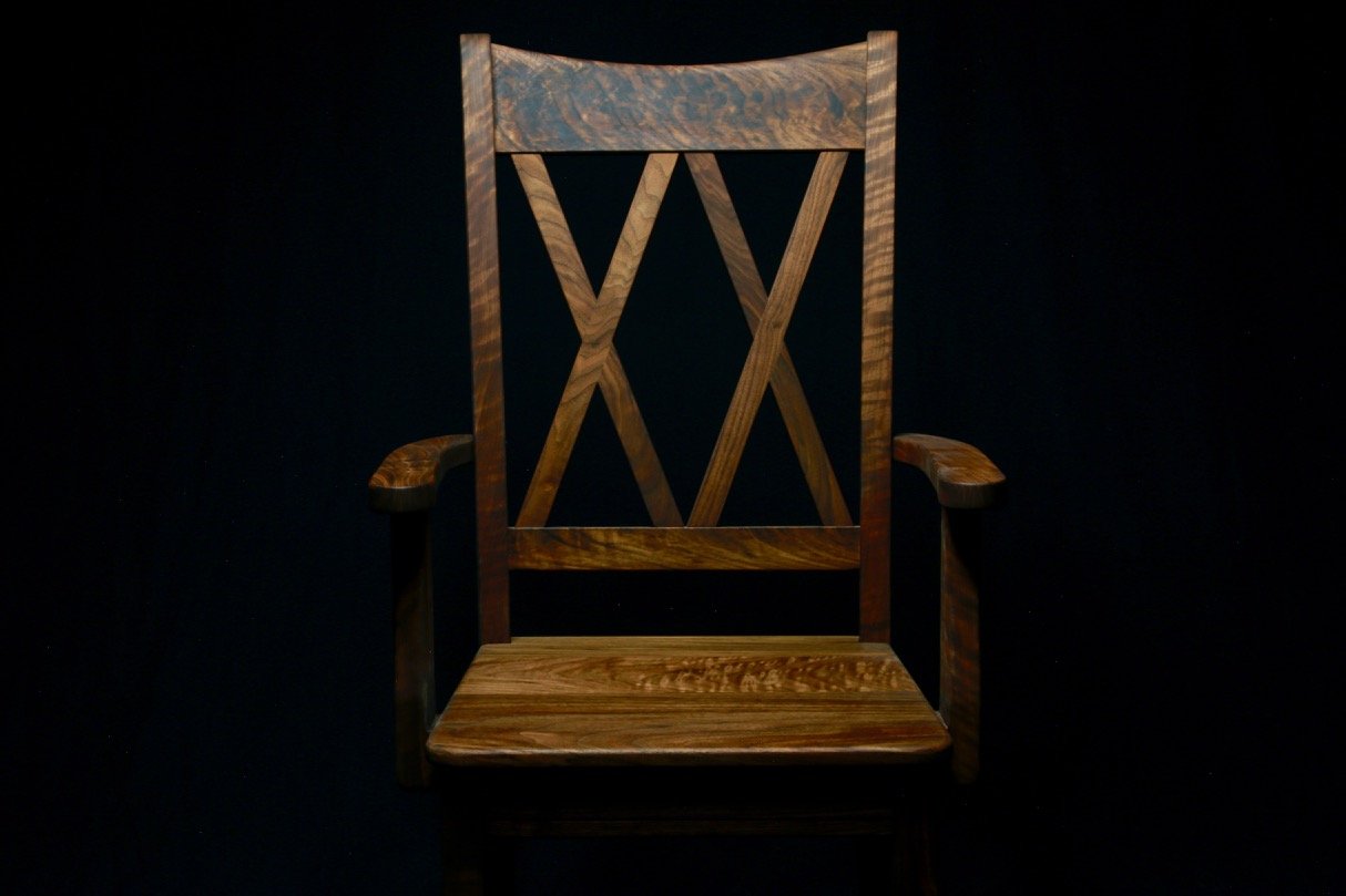 Custom built walnut wooden chair with crisscross X back design.