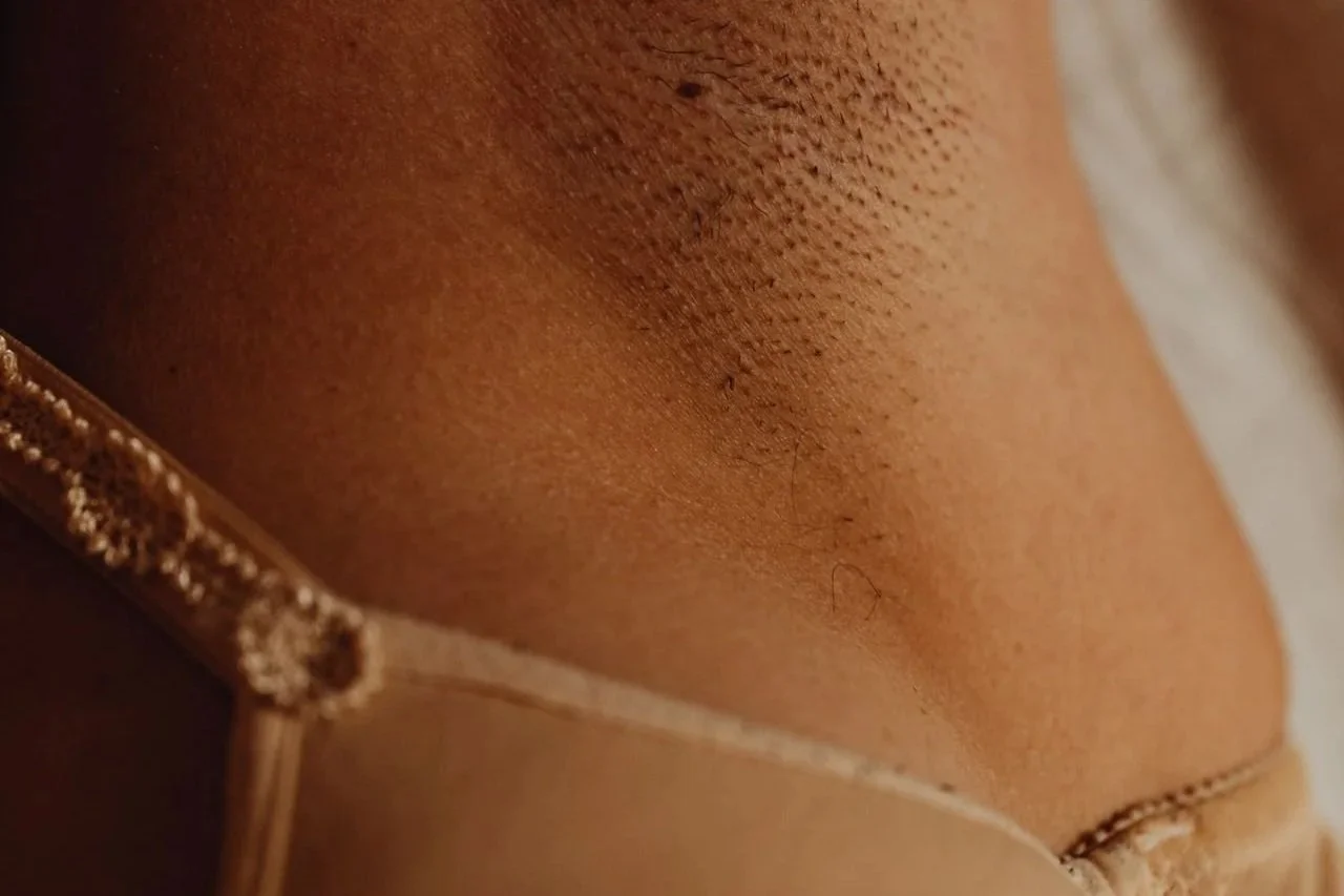 Close-up of underarm hair regrowth before a waxing appointment