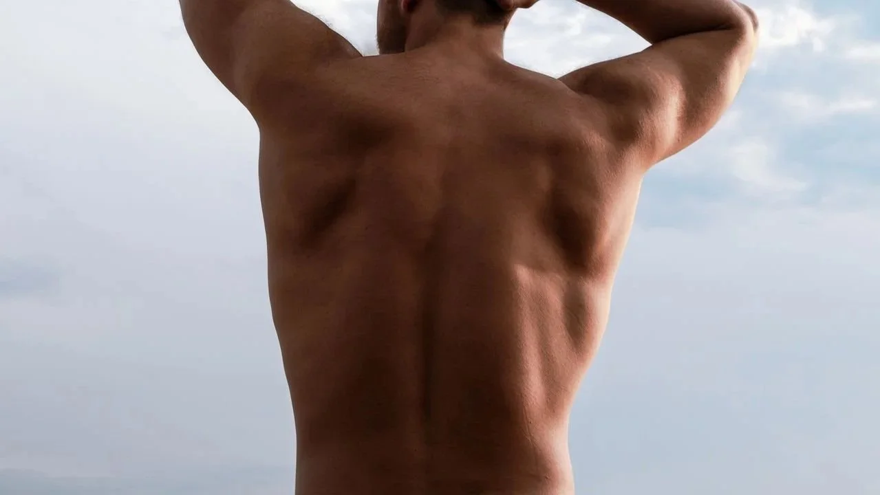 Man with bare back outdoors