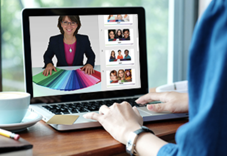 Person working on a photo editing or graphic design project on a laptop, displaying a woman smiling with a color wheel and smaller images of people on the screen.