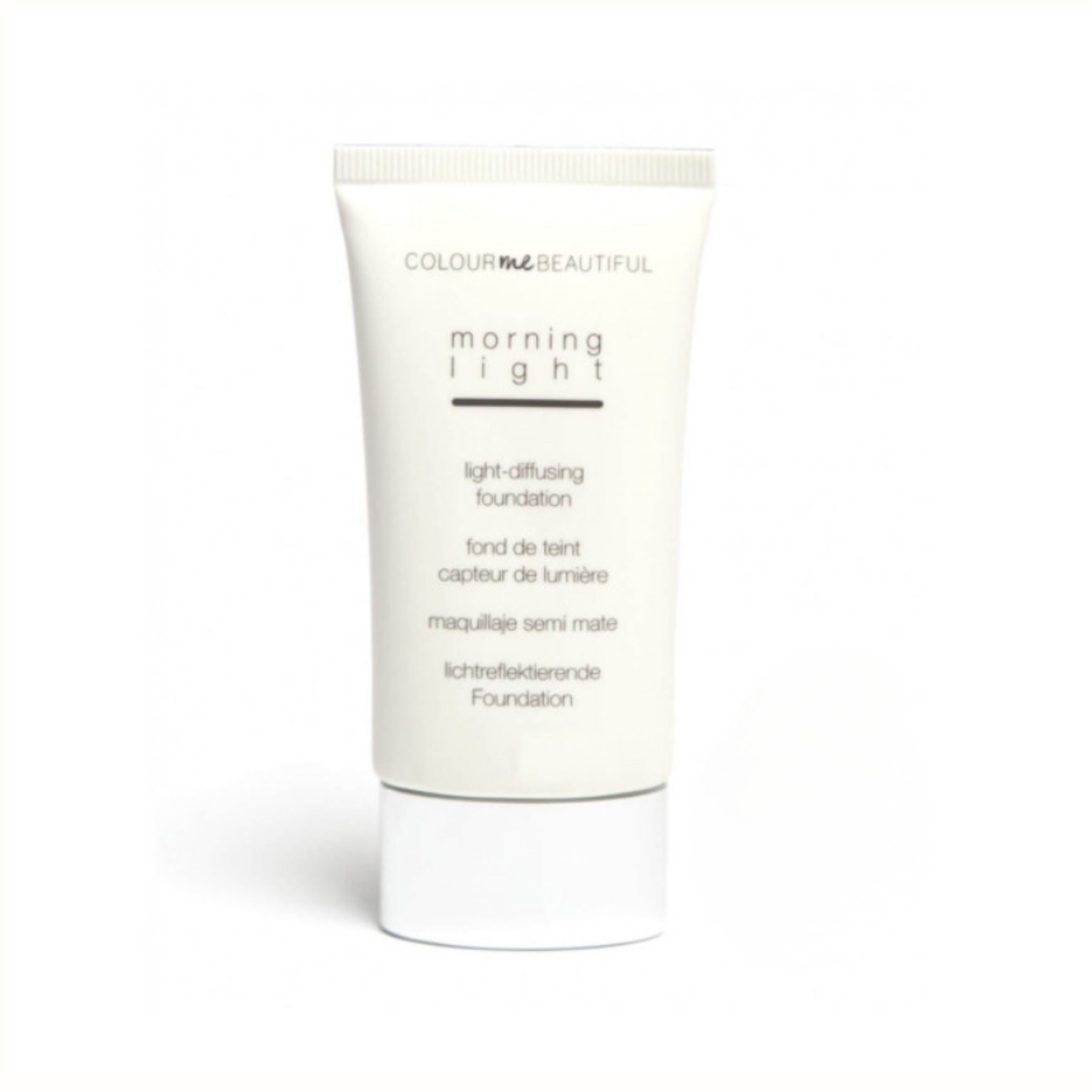 A white tube of light-diffusing foundation with black text, labeled 'COLOUR me BEAUTIFUL morning light'. The tube has a beige screw-on cap and is set against a plain white background.