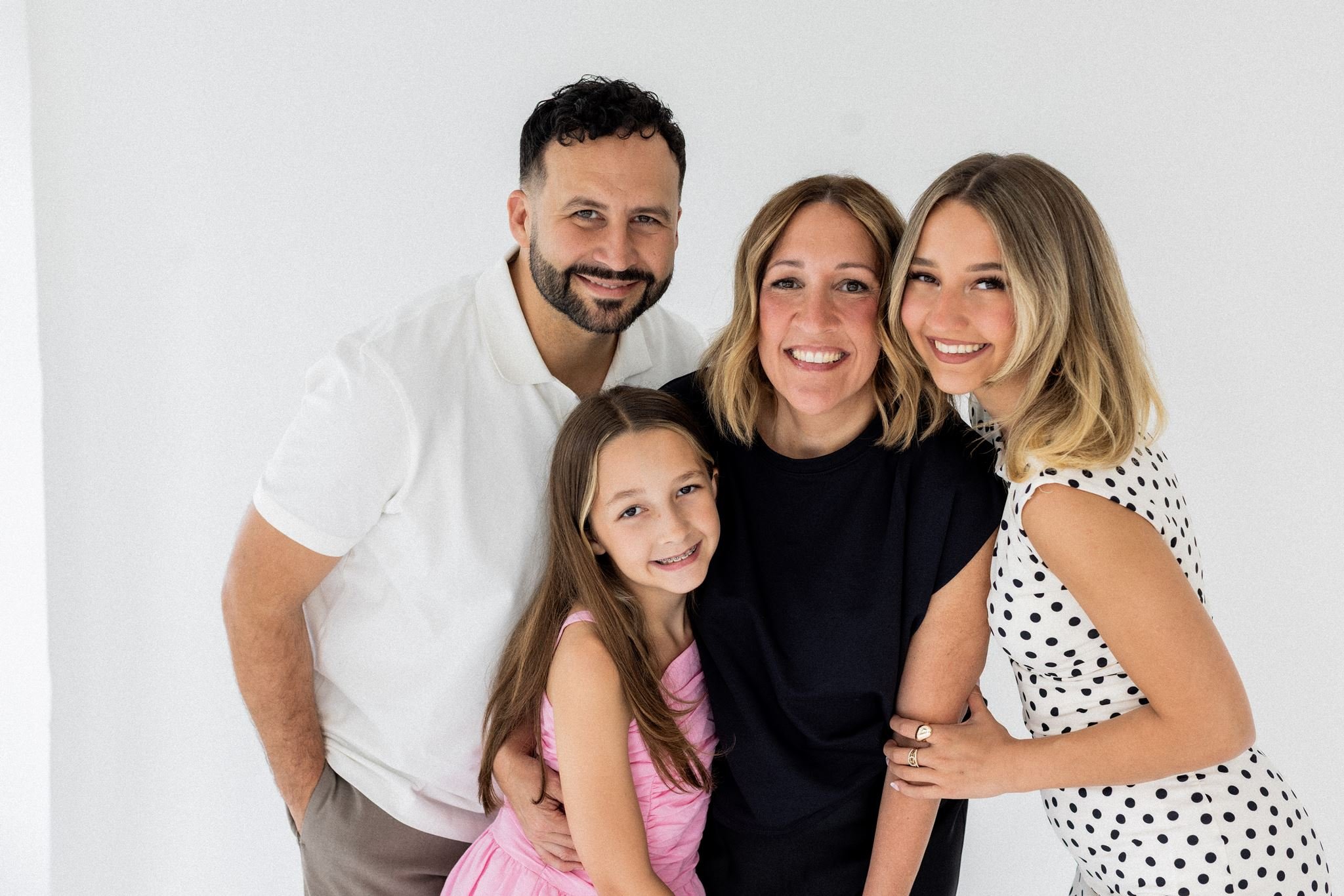 Mike Signorelli with his family in a studio portrait.