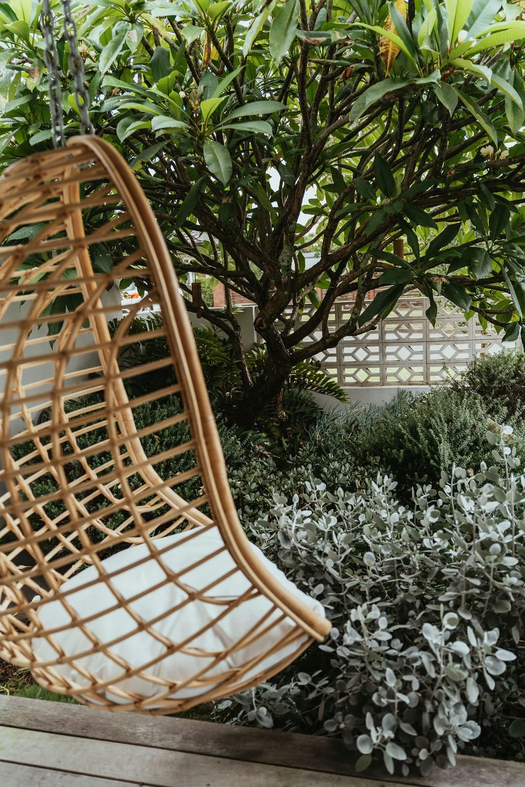 Hanging chair rattan outside.jpg