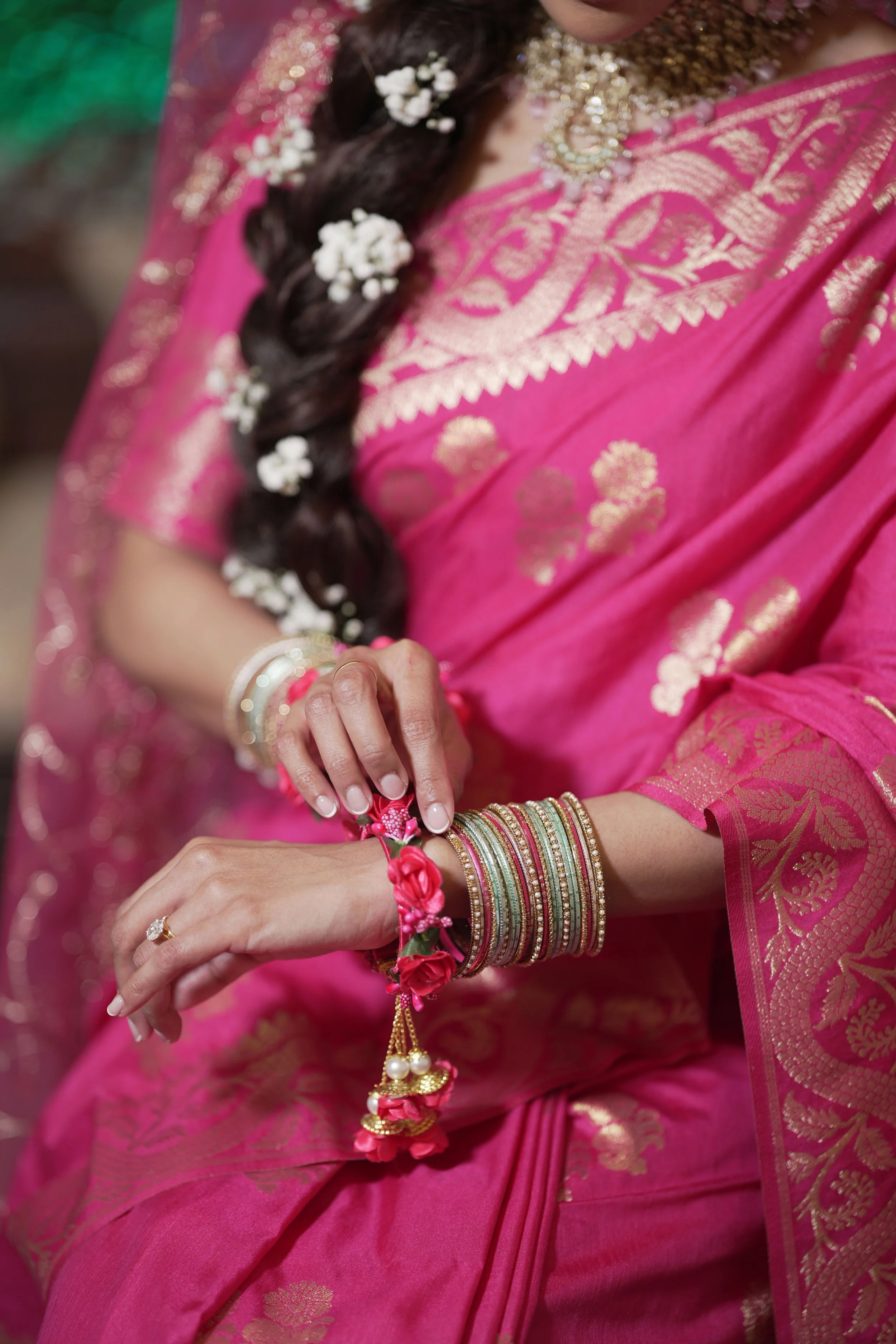 bride showing her bangles on her mehndi day.
