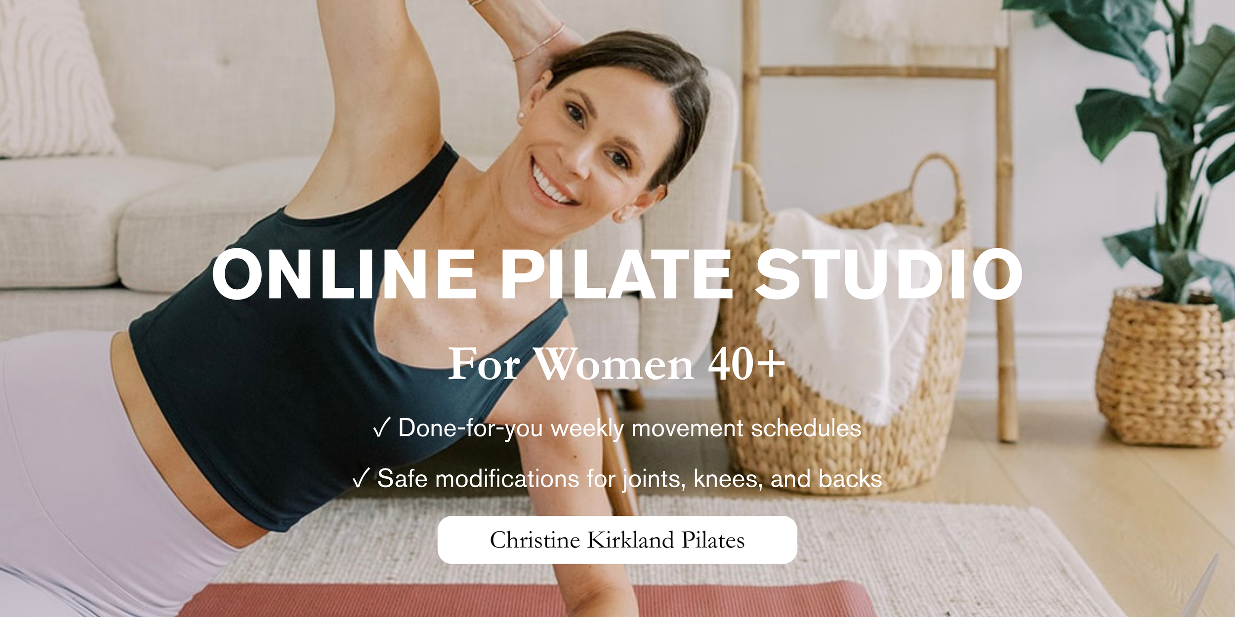 online pilates instructor christine kirkland smiling to camera demonstrating a pilates move