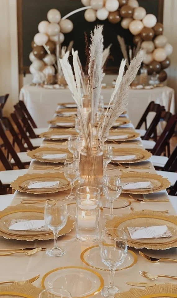 table setup with gold plates and feathers.JPG
