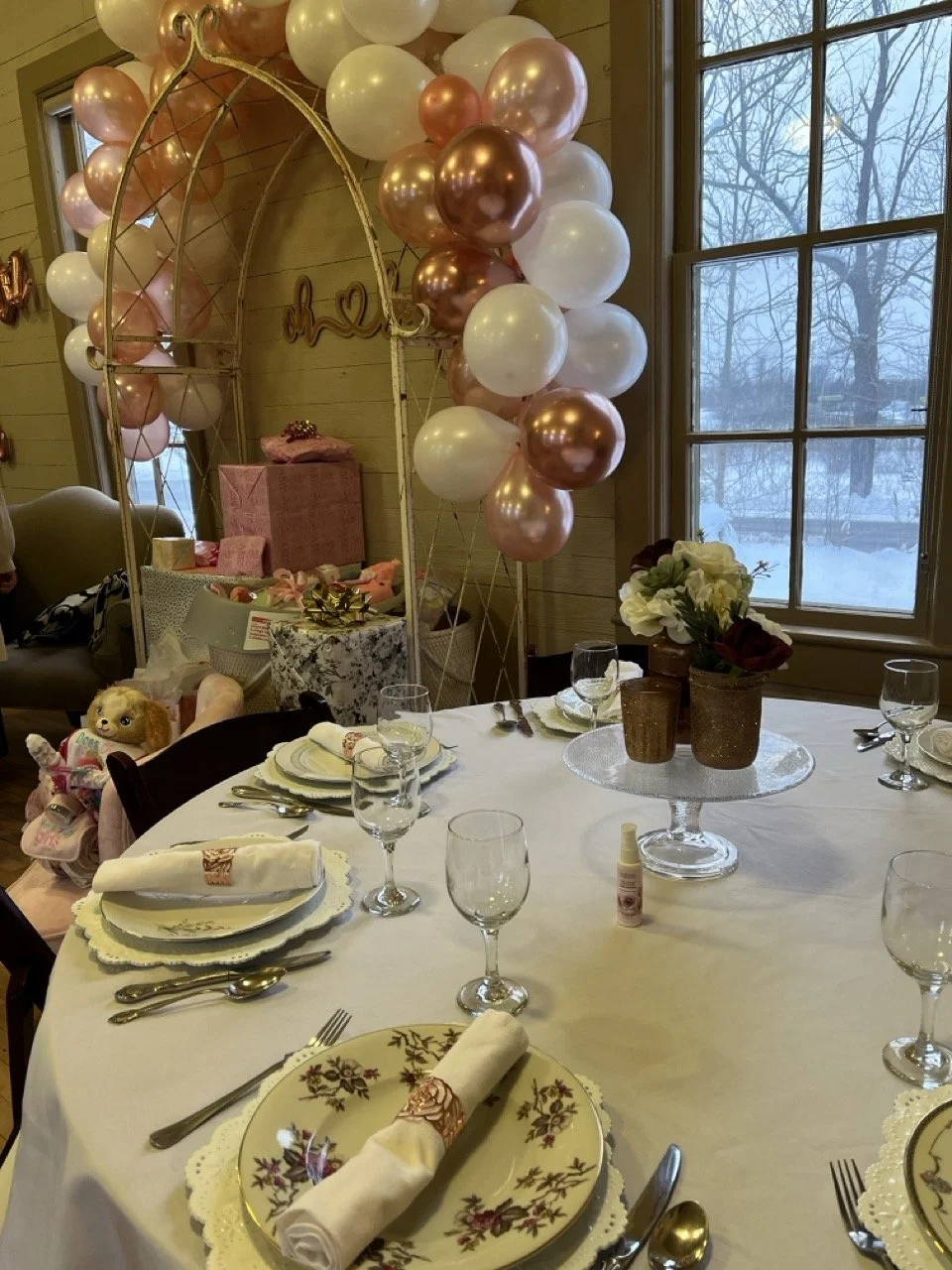 pink balloon arch with table setup.jpeg