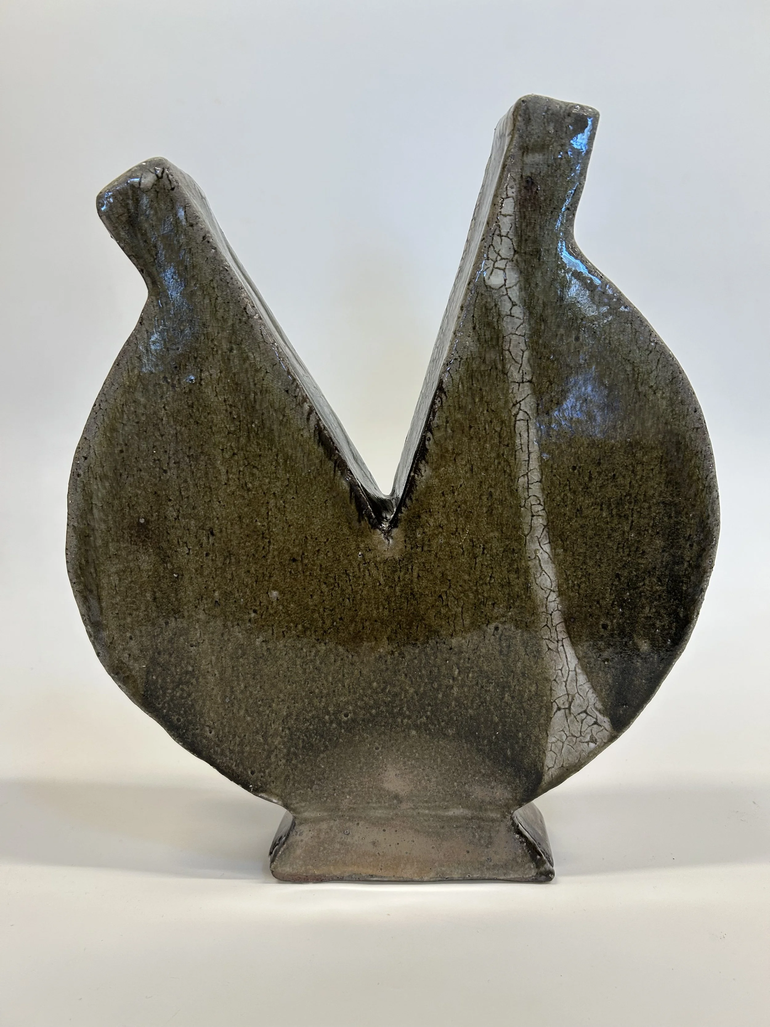 Weathered Hold: This piece carries the visual language of fracture and repair. Its form suggests a moment of pause—something opened, but not undone. The split becomes a place of tension and possibility, where surface and structure reveal the quiet im