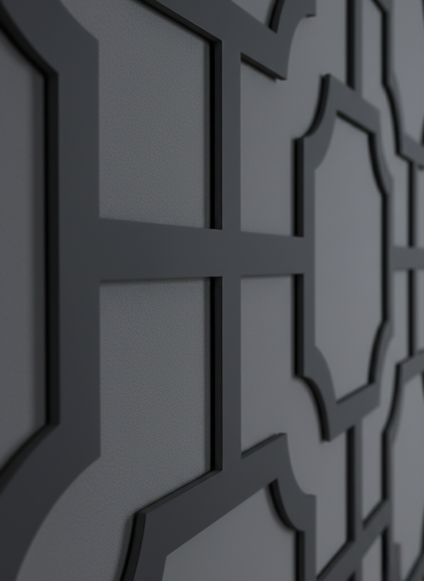 A macro detail shot of the Manhattan black expanded PVC wall panel with a geometric fretwork design.