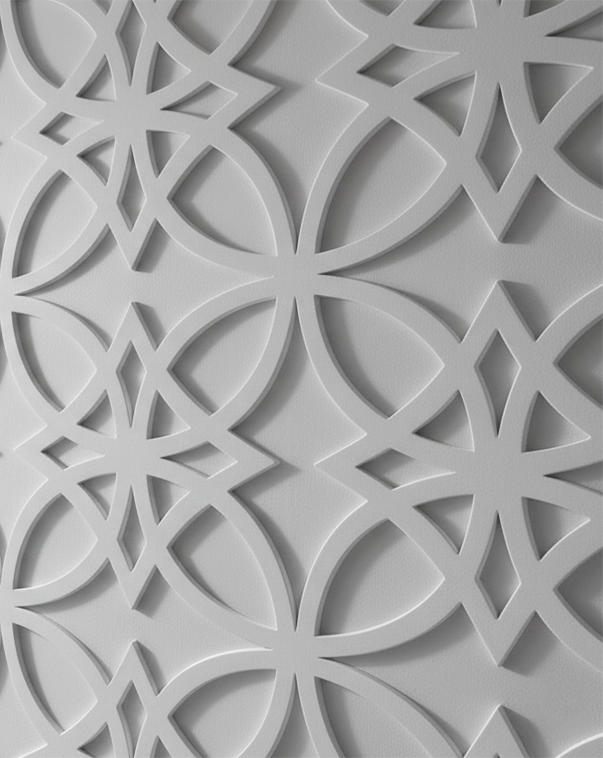 Close-up detail of 'Willow Bloom' architectural wall panels showing the 3D depth and intricate floral starburst pattern in a matte off-white finish.