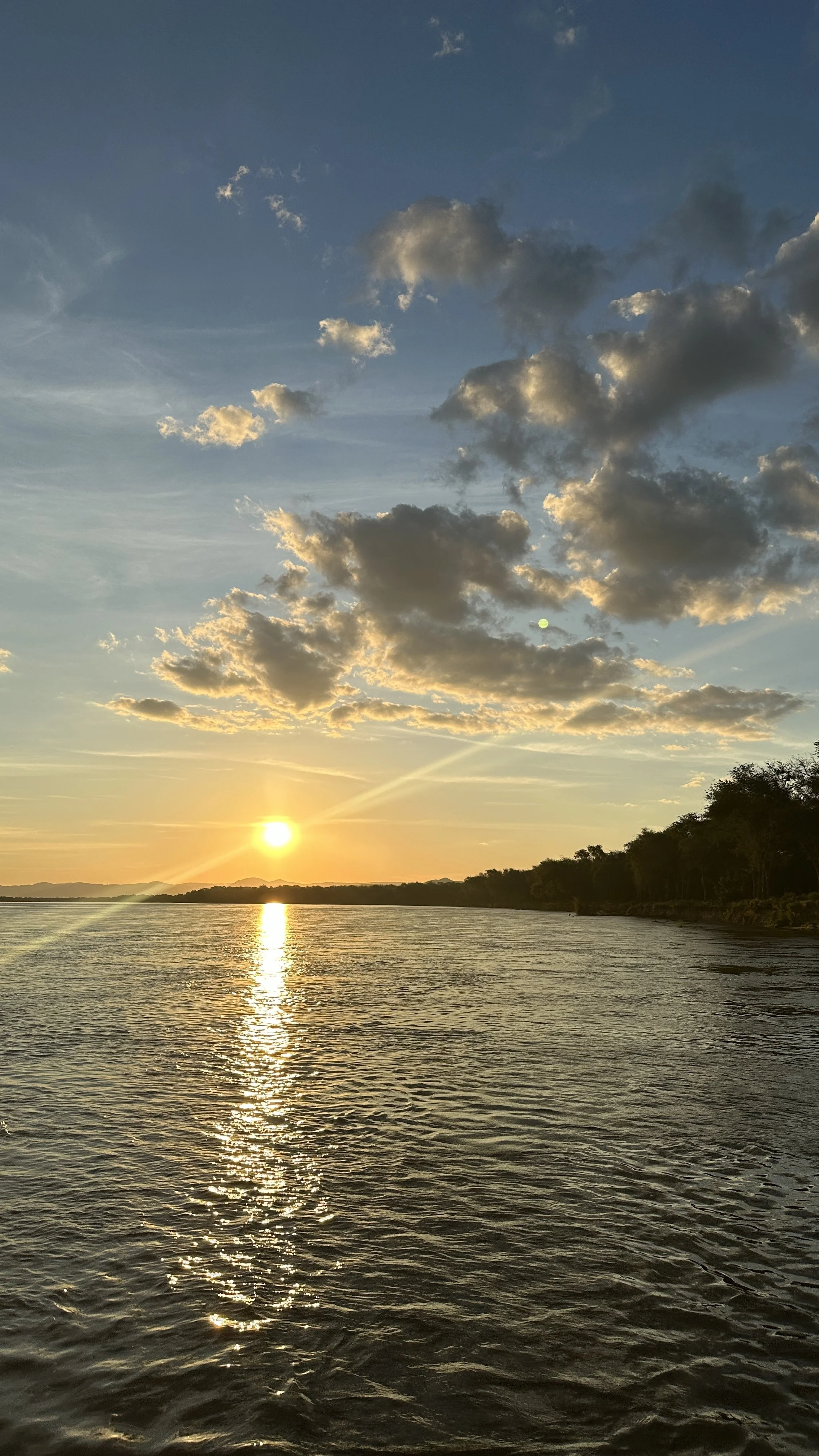 River fishing and safari activity at Anabezi in Lower Zambezi watching the sunset