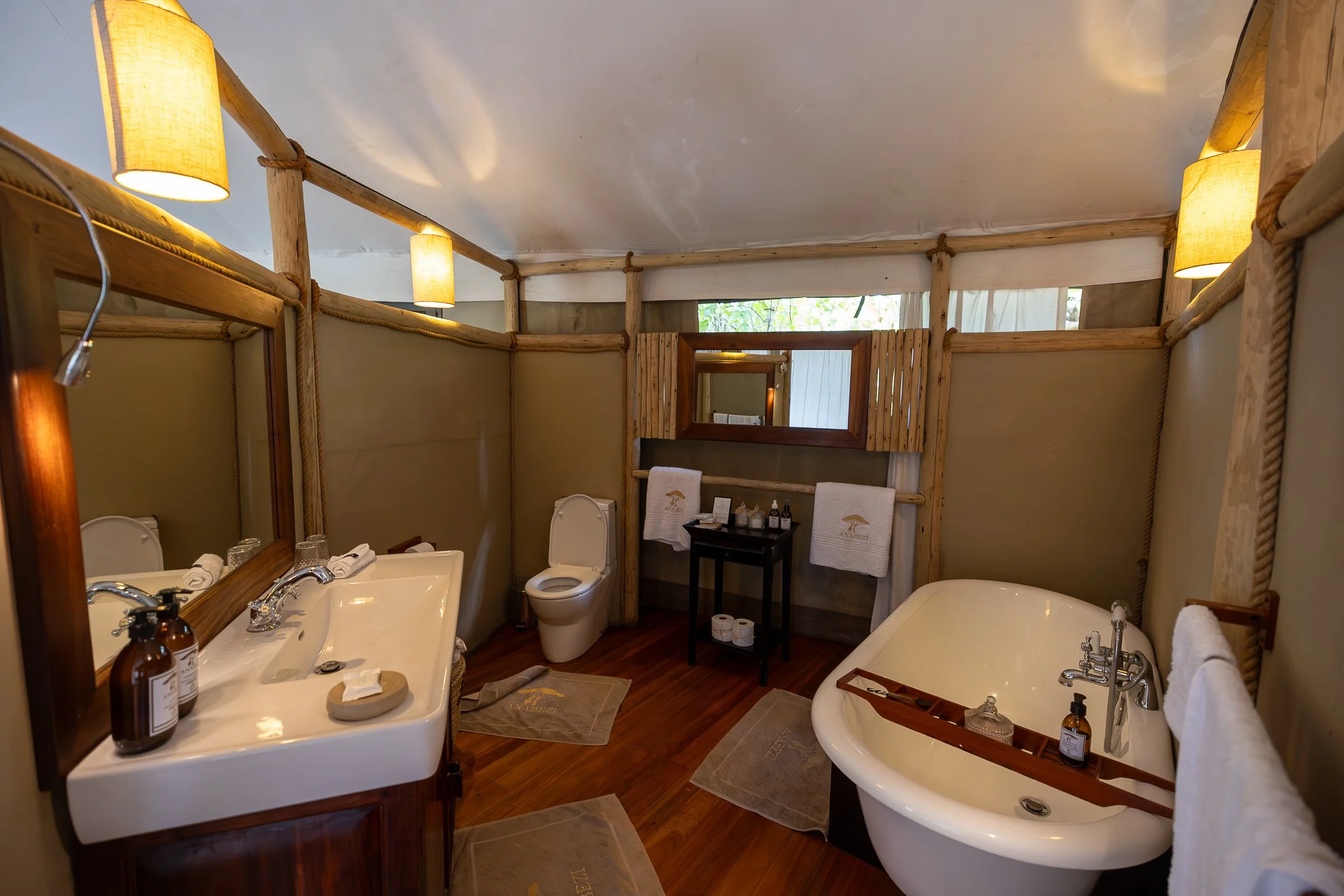Bathroom and indoor bath in an Anabezi Camp guest suite