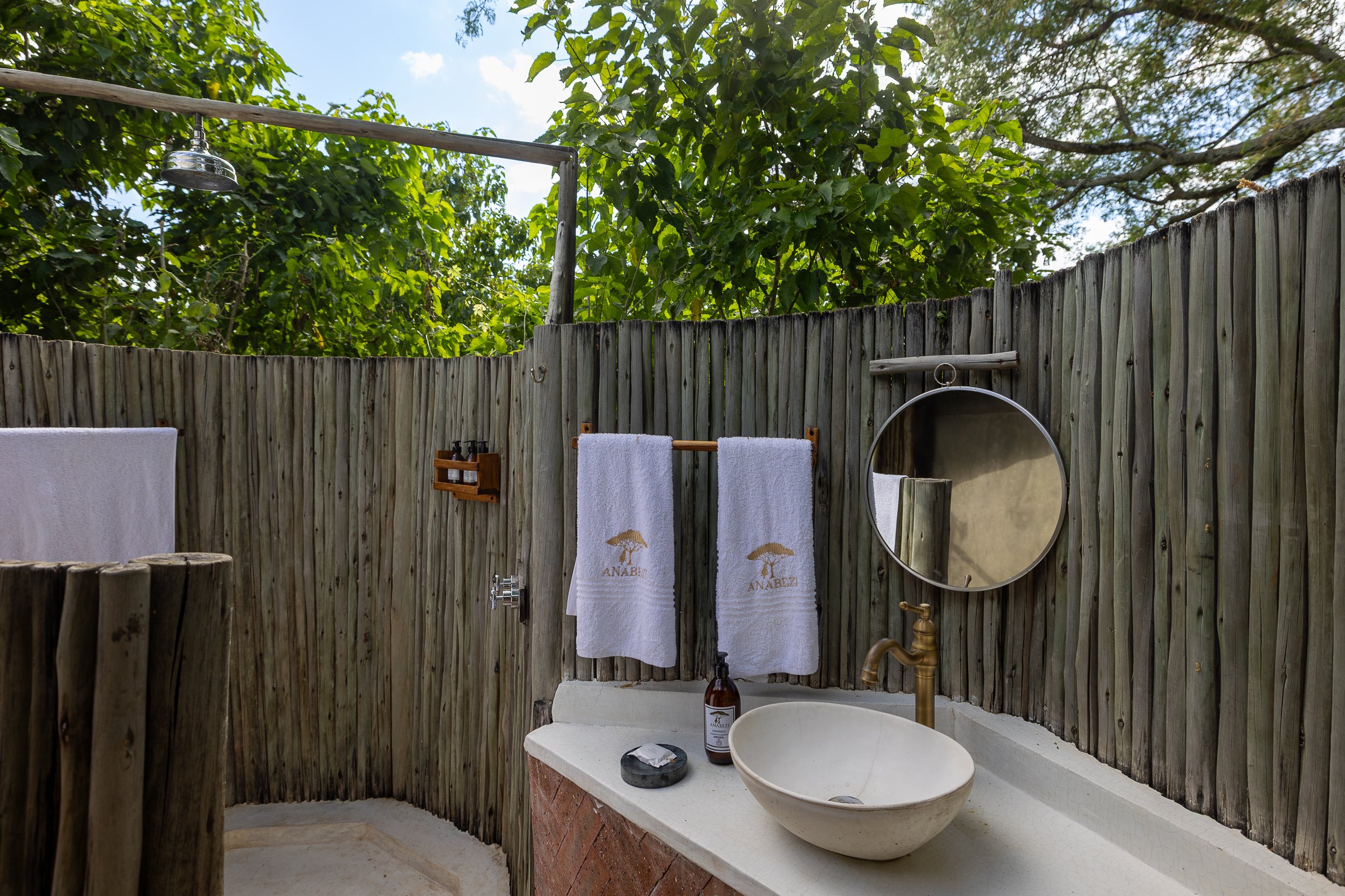 Luxury tented suite with bed and deck at Anabezi Camp