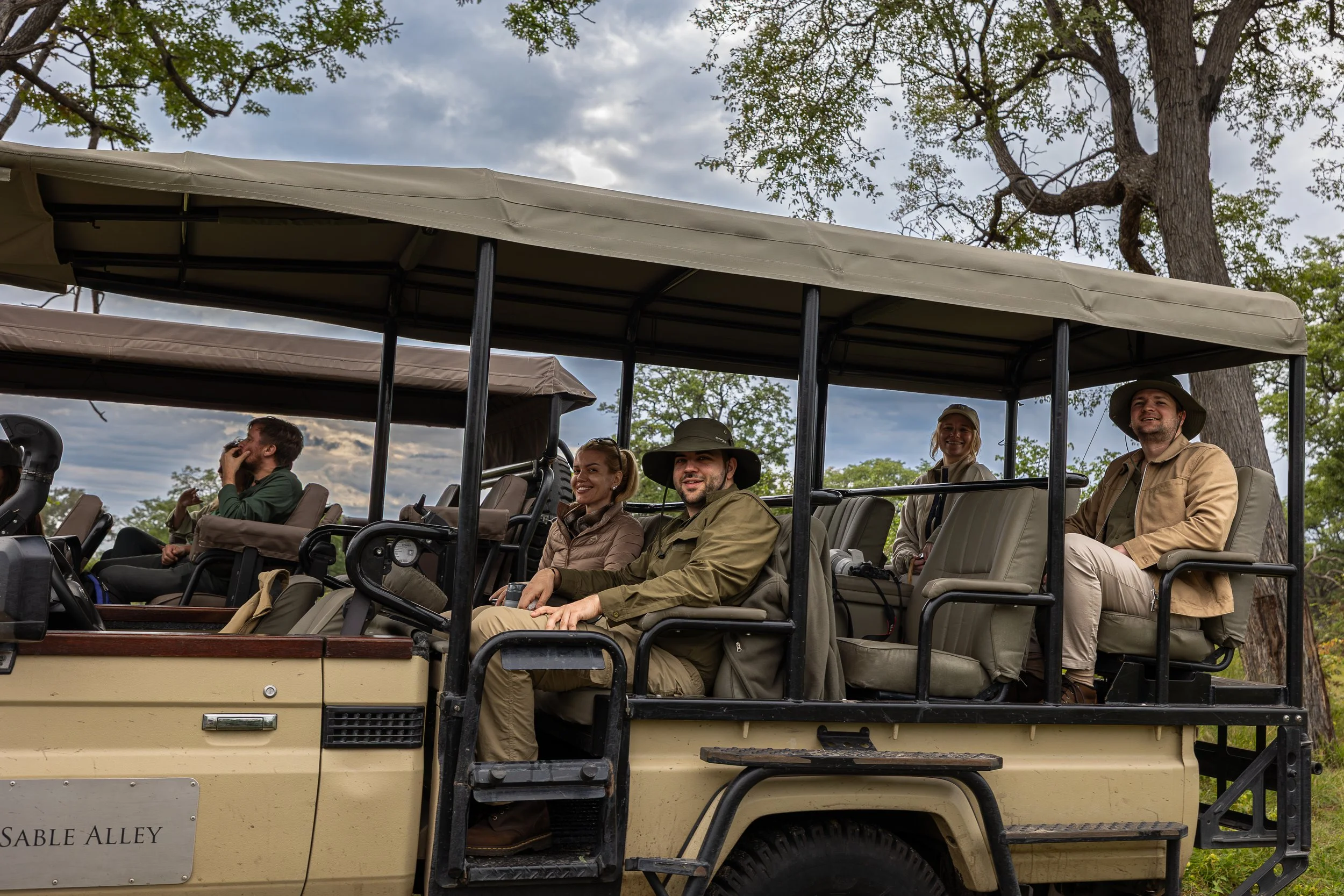 Guests on a safari vehicle in Khwai private game reserve