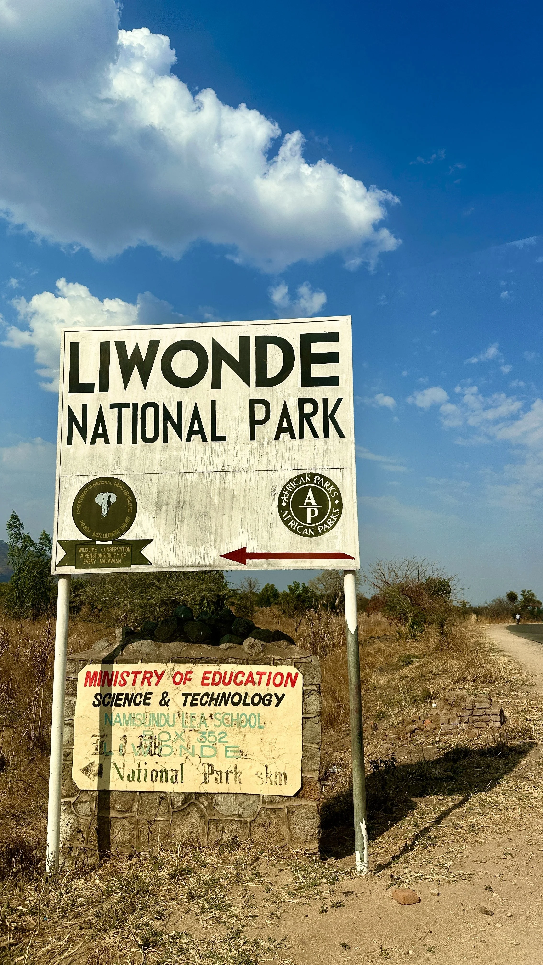Large roadside sign indicating the turn-off to Liwonde National Park in southern Malawi.