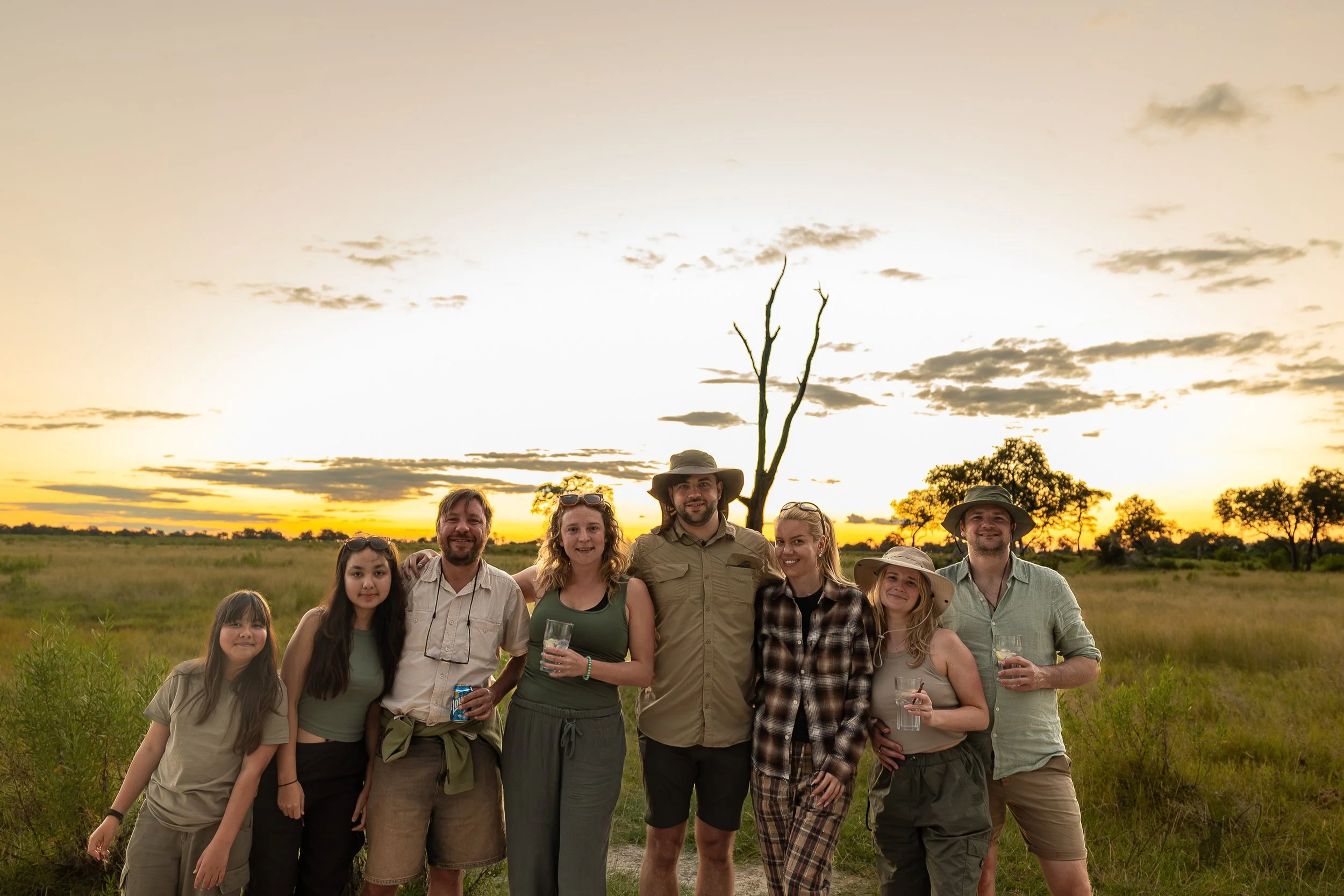 Guests enjoying a sunset safari in Botswana’s Okavango Delta with WildLens Adventures