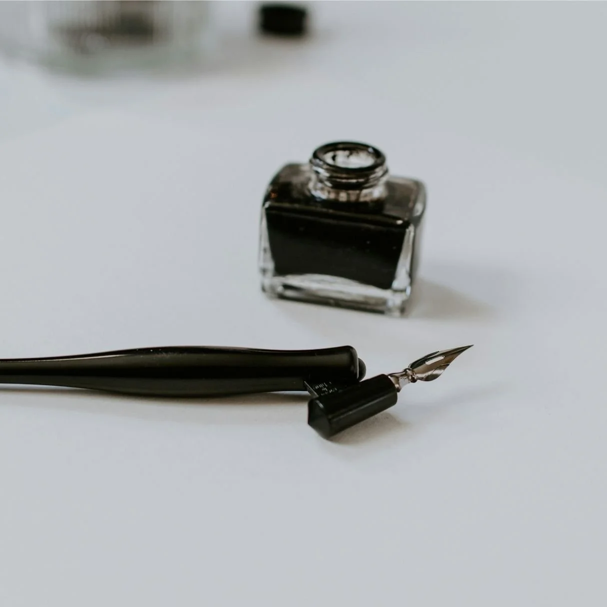 Vintage fountain pen and ink bottle symbolising personal luxury consultation and bespoke appointment booking