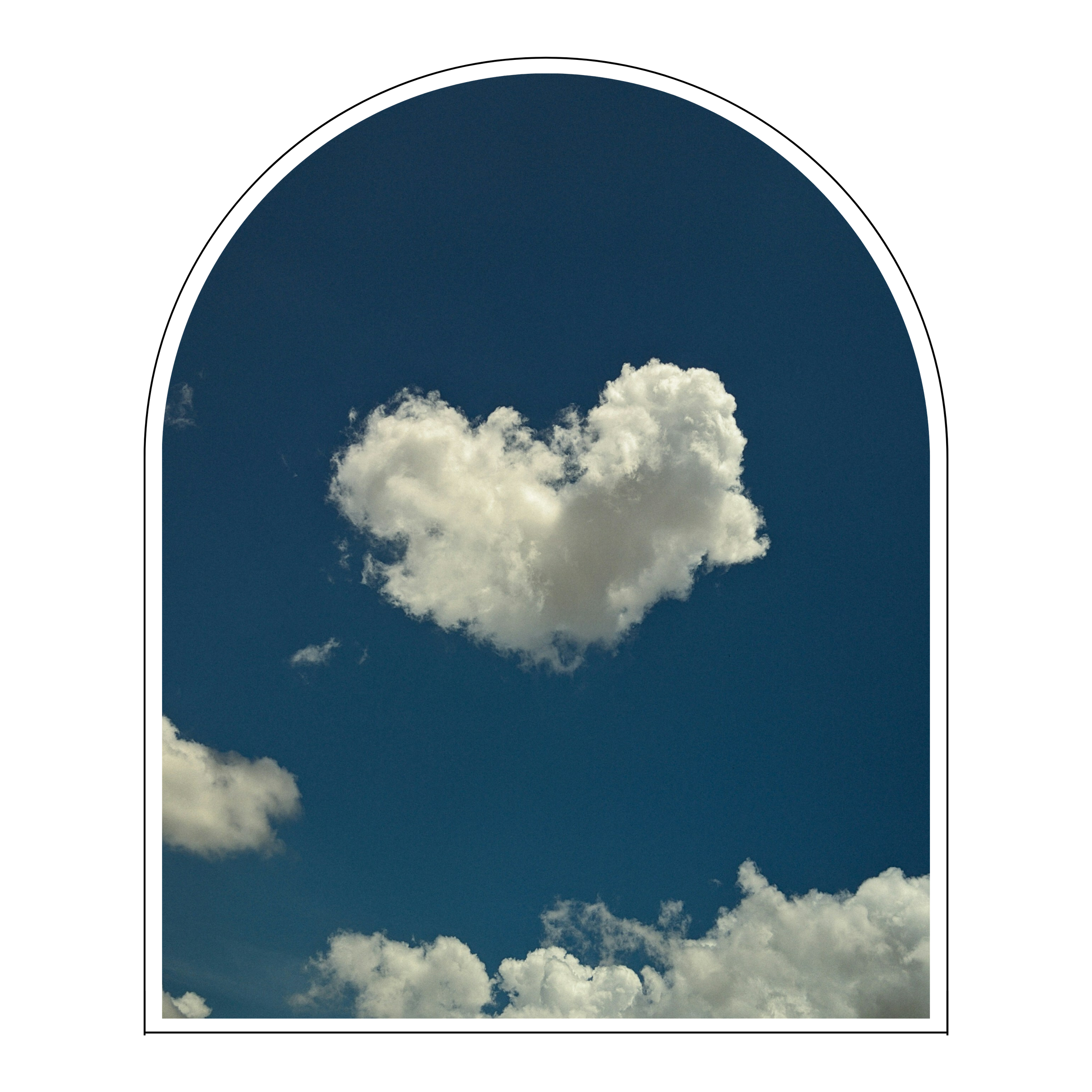 Cloud shaped like a heart in a blue sky with other clouds.