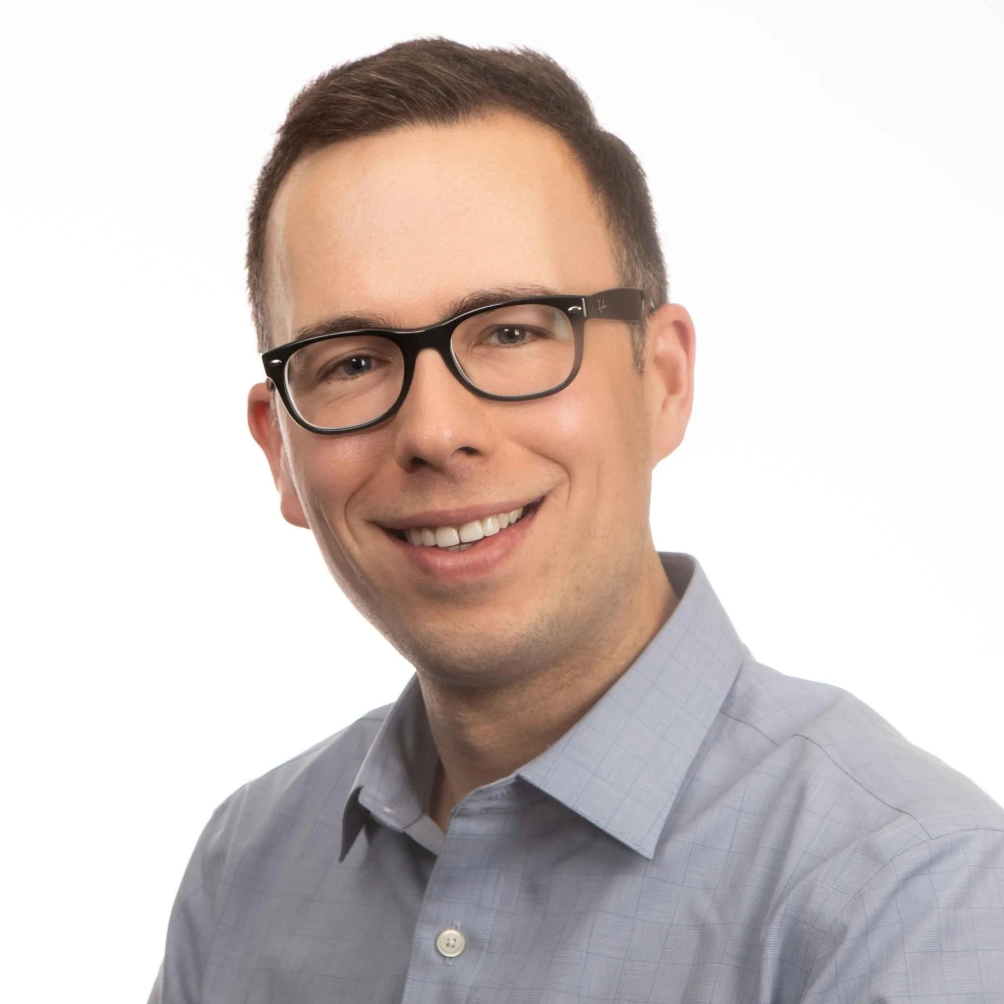 Ontario-based licensed psychologist providing client-centered support and mental health services across all life stages at Stillpoint Psychology.
Headshot of a smiling man with short brown hair, wearing black-rimmed glasses.