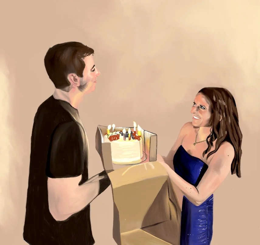 A woman in a blue dress is smiling and accepting a birthday cake with lit candles from a man in a black shirt, during a celebration.