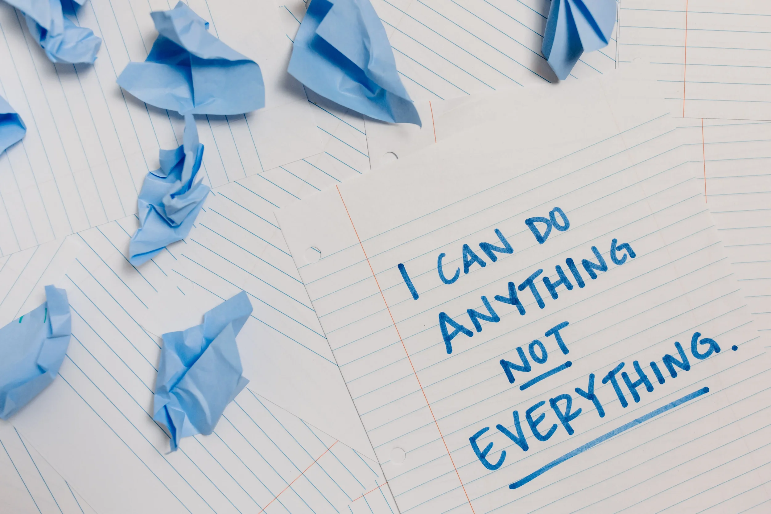 A piece of paper that reads "I can do anything not everything."