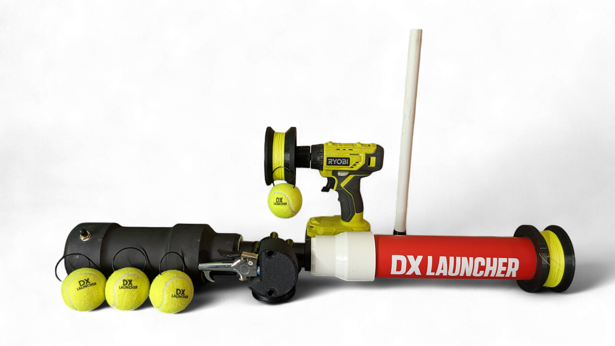 A homemade tennis ball launcher with a red tube labeled "DX LAUNCHER," a yellow cordless drill attached to a black pipe, a spool of yellow string, and three tennis balls with "DX LAUNCHER" printed on them, all against a black background.