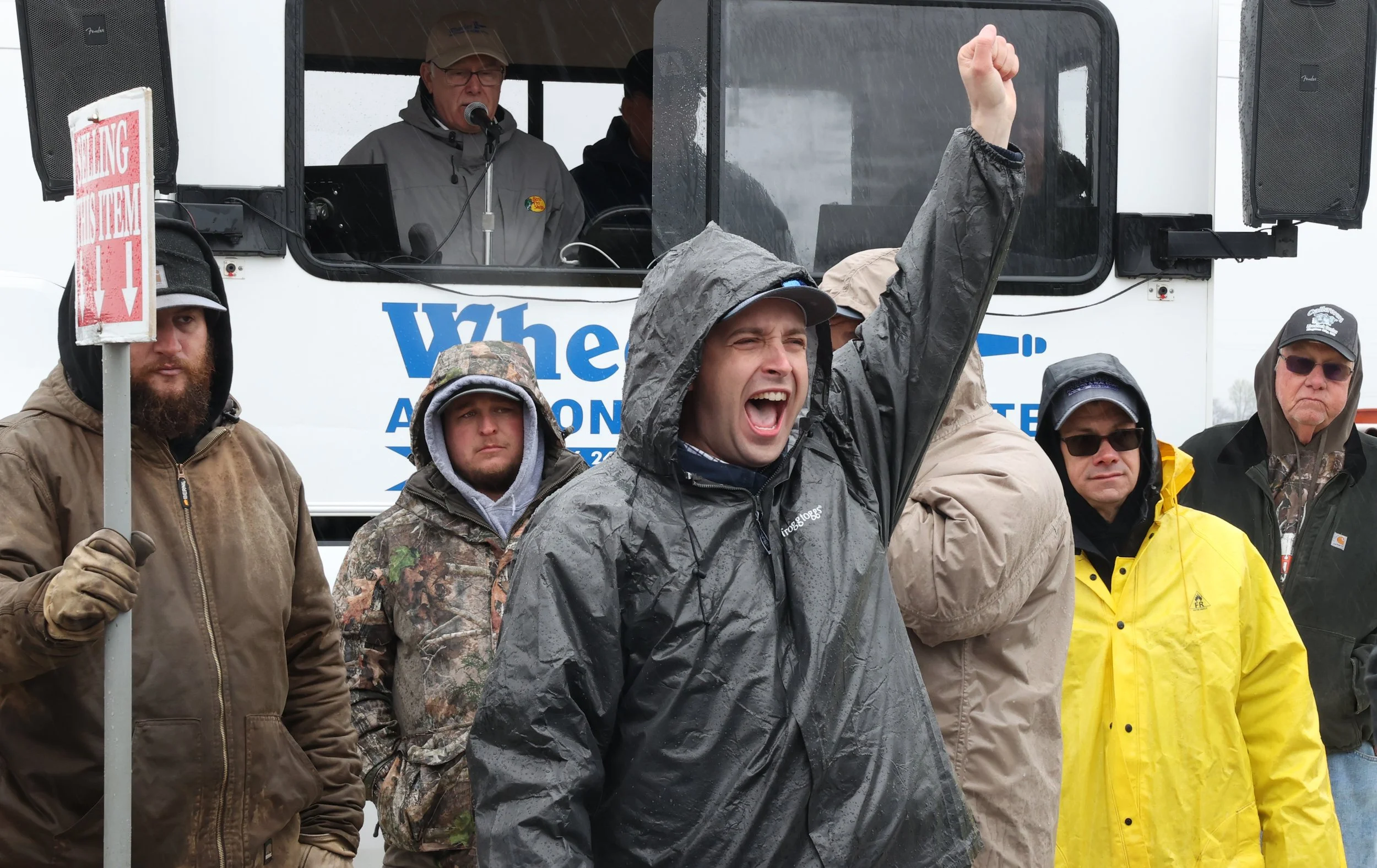 Harrison cheers as someone places a bid during the semiannual auction on April 5, 2025, at Wise Bros. Inc. in Kingdom City, Mo. The auction is an opportunity for farmers to sell and buy various pieces of equipment. “The strength of the market was ful
