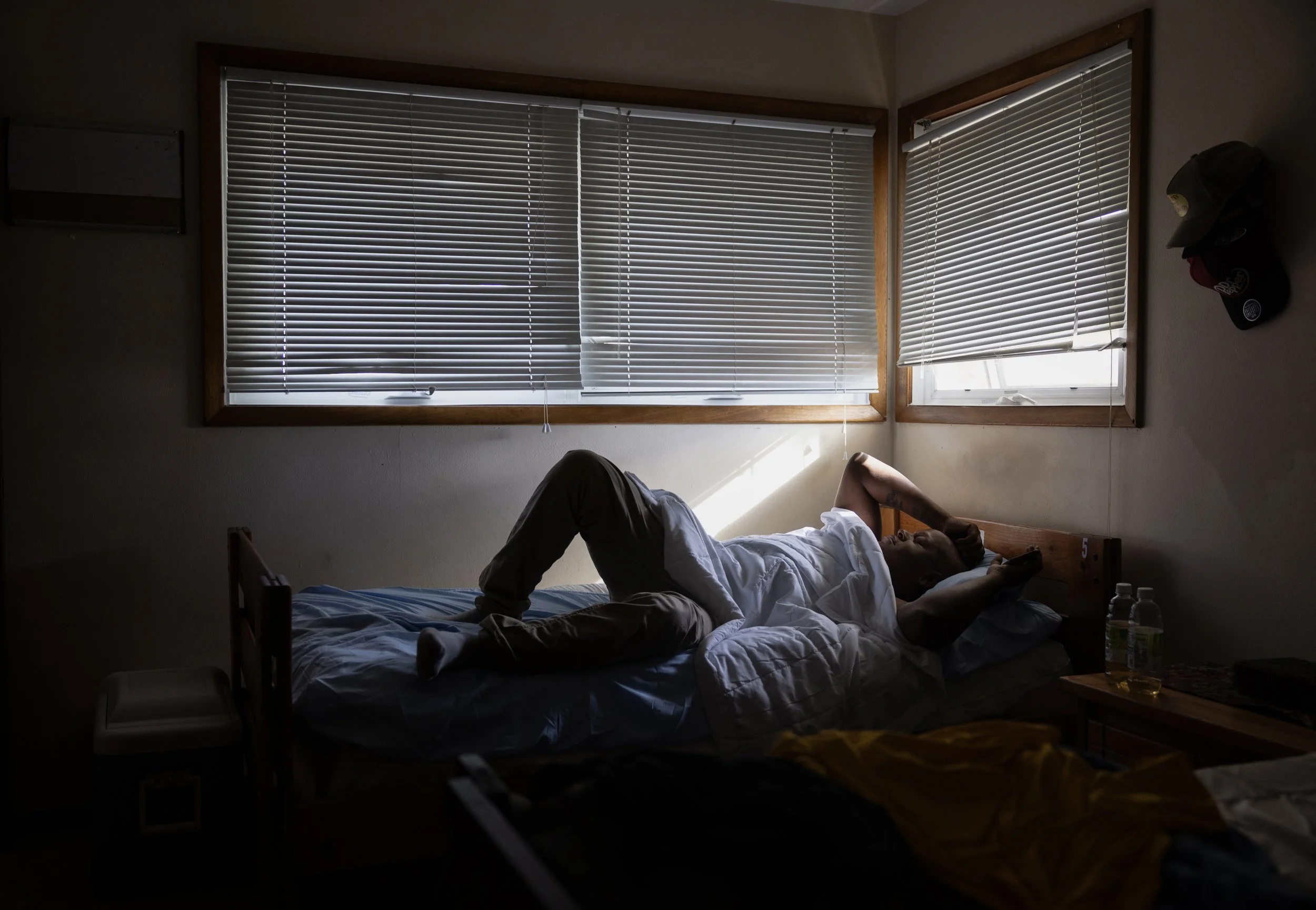 Bobby Brandy wakes up from a nap at the Daisy House, one of the shared houses for program participants at in2Action. The Daisy House lies right across the street from Bobby's late aunt's old house. He used to spend a lot of his time at the house gett