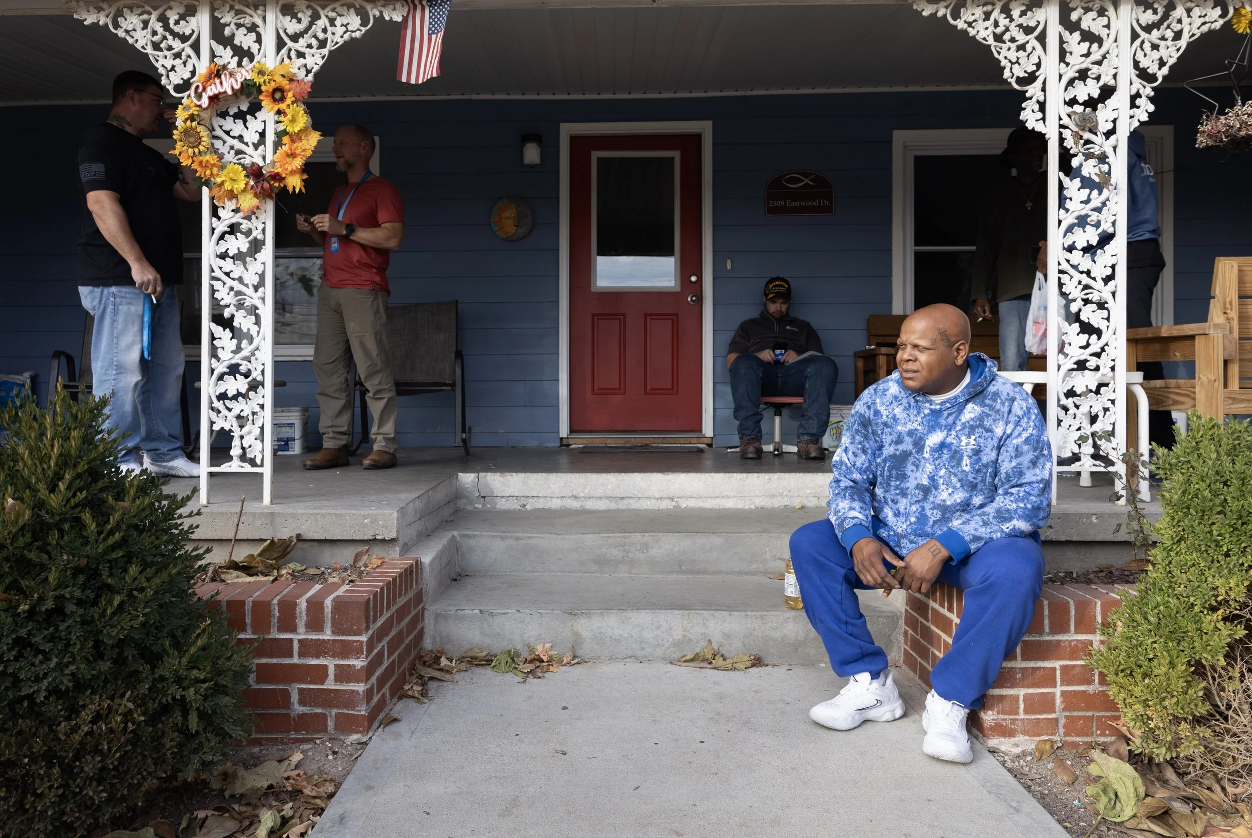 Bobby sits on the porch across from his aunt's old house before a skill drill class. After everything he's been through, Bobby views the house differently. “I would be in the garage, hanging with some people and I’m down there getting high," Bobby sa