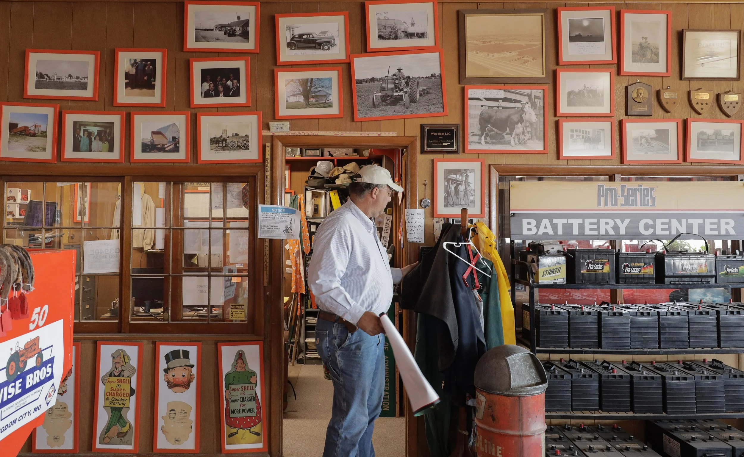 David Backer hangs up his coat on March 20, 2025, at Wise Bros. Inc. in Kingdom City, Mo. Many of the decorations for the store are meant to be reminiscent of a home, highlighting their family-oriented business.