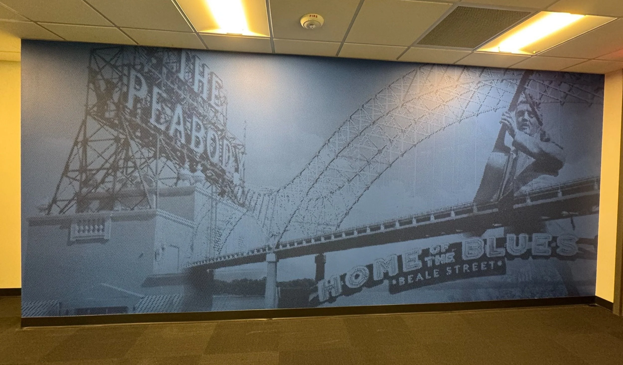 Black and white mural of the Fremont Street Experience in Las Vegas, featuring a vintage sign that says "Welcome to the Fabulous Fremont Street" with a large guitar sculpture.